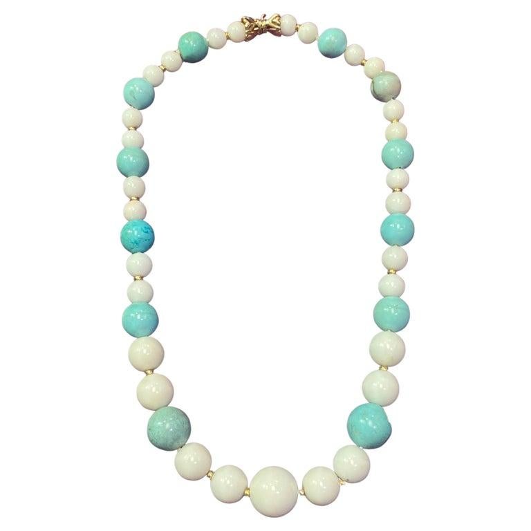 White Coral & Turquoise Bead Necklace

A necklace with white coral and turquoise beads with gold spacers throughout

Metal Type: 14 karat yellow gold

Length: 16.5