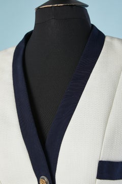 White cotton skirt-suit with navy gros-grain piping and camellia's button Chanel