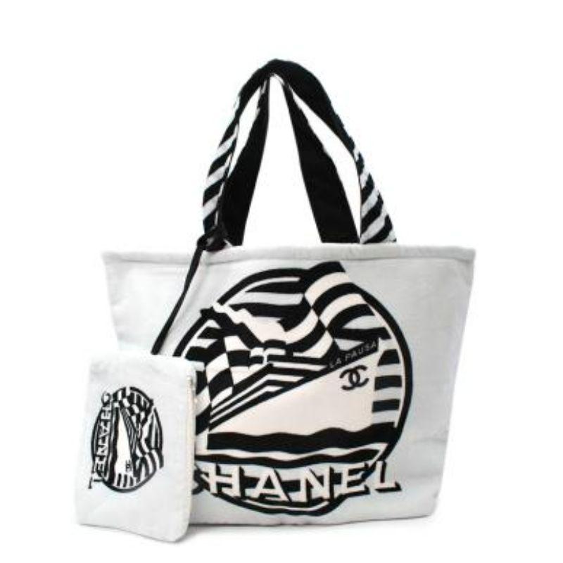 Chanel White Cotton Terry La Pausa Beach Tote Bag
 
 
 
 - Soft white towling body
 
 - Large Chanel logo black print
 
 - Black and white stripe handles 
 
 - Red, pink and grey stripe printed canvas lining 
 
 - Small detachable zip pouch 
 
 
 
