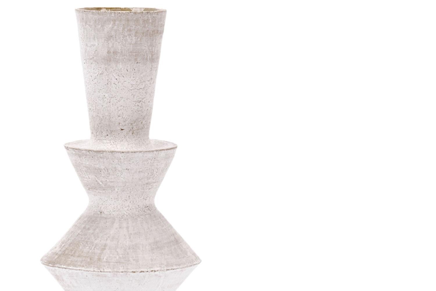 TRK vase, humble matter
TRK vase is part of the handmade vase collection by artist John Born in Brooklyn, NY in a white stoneware finish. Each signature piece is designed to complement the others as a group or stand alone to enhance the decor of