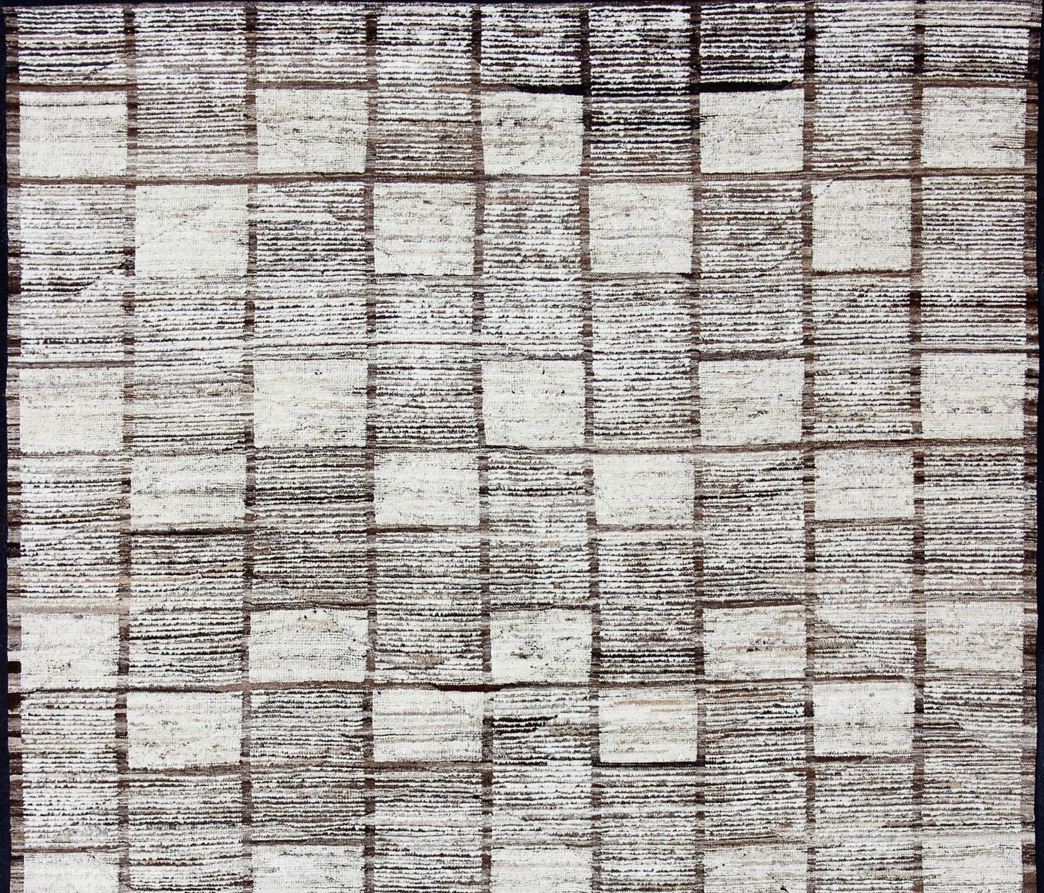 Keivan woven Arts-Modern piled rug with checkerboard design in natural wool tones, rug AFG-33324, country of origin / type: Afghanistan / Piled, condition: new

This new creation of modern distressed rug features checkerboard design and in cream,
