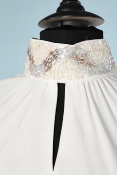 White crêpe cocktail dress with beaded collar and cuff