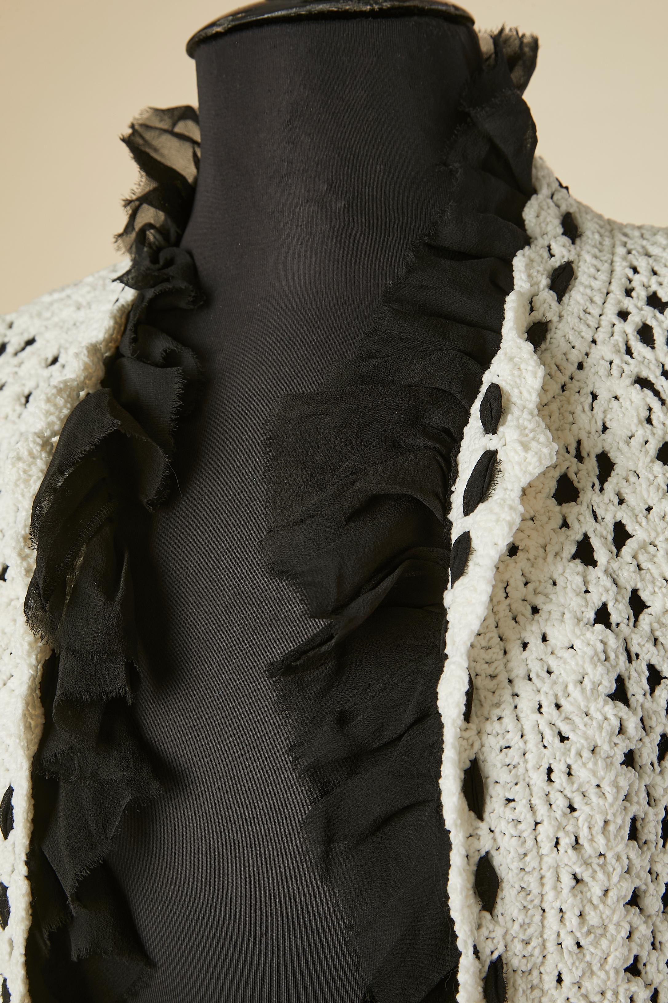 White crochet long cardigan with silk chiffon incrustation on the edge .
Crochet composition: 81% nylon, 18% cotton, 1% elastane. 
SIZE 40 (Fr) M 