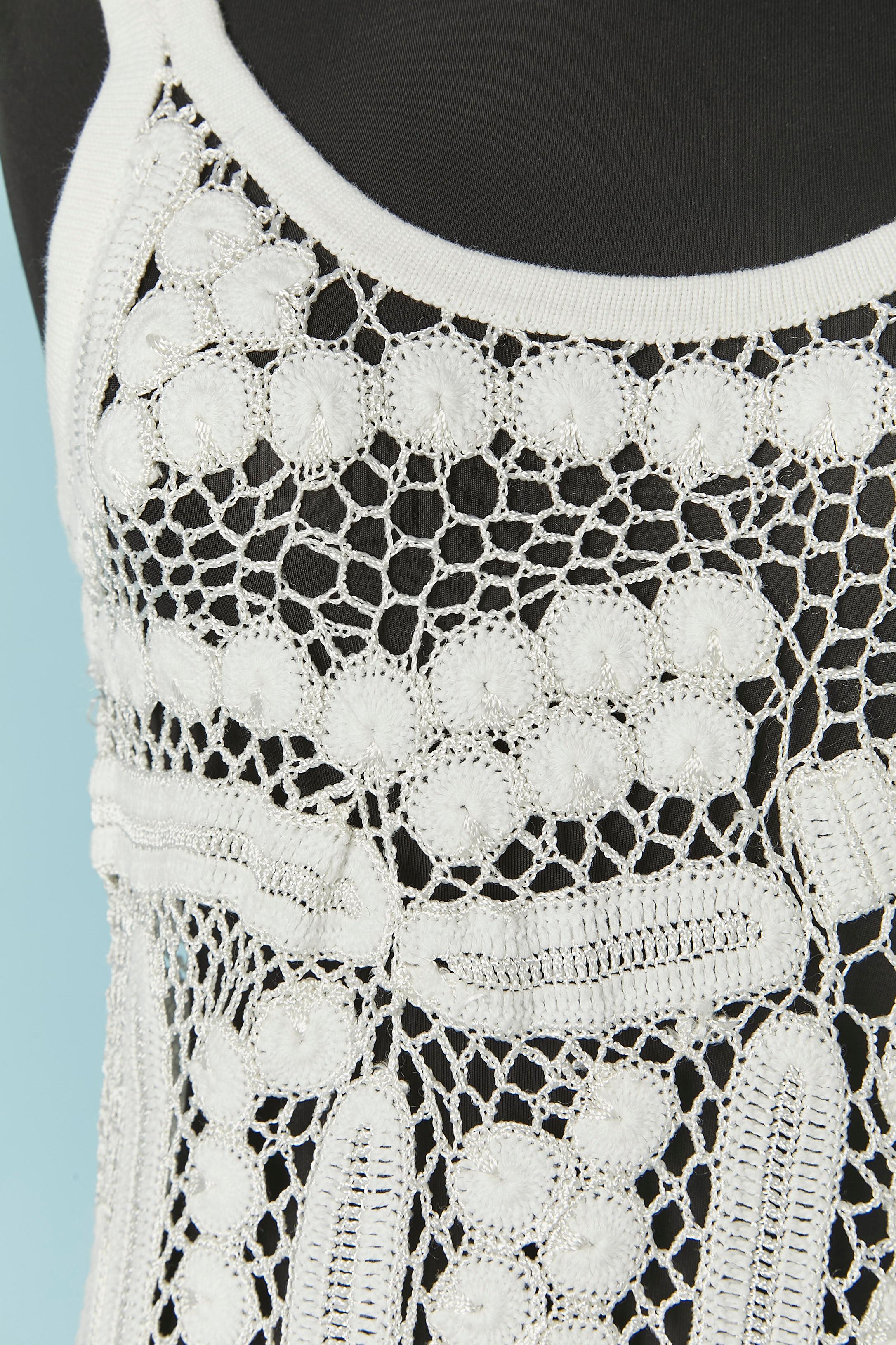 White crochet tank-top. The thread composition tag has been cut but there is 2 different quality cotton and rayon ( more shiny thread) 
SIZE S 