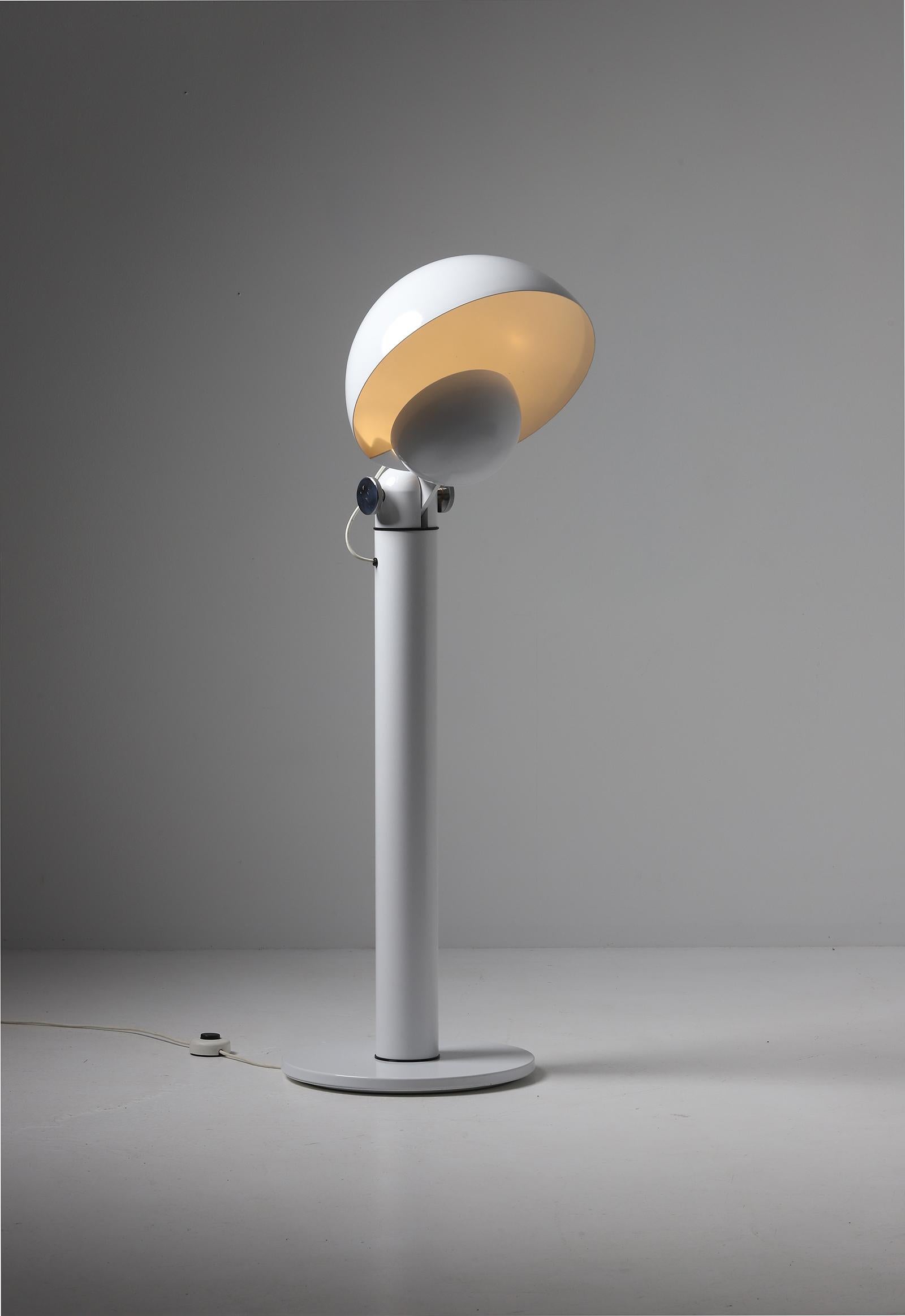Cuffia floor lamp designed by Francesco Buzzi for Bieffeplast in 1969. This postmodern lamp is made out of a white lacquered aluminum with two adjustable shades who can turn 180 degrees. The use of the two shades gives the lamp a highly decorative