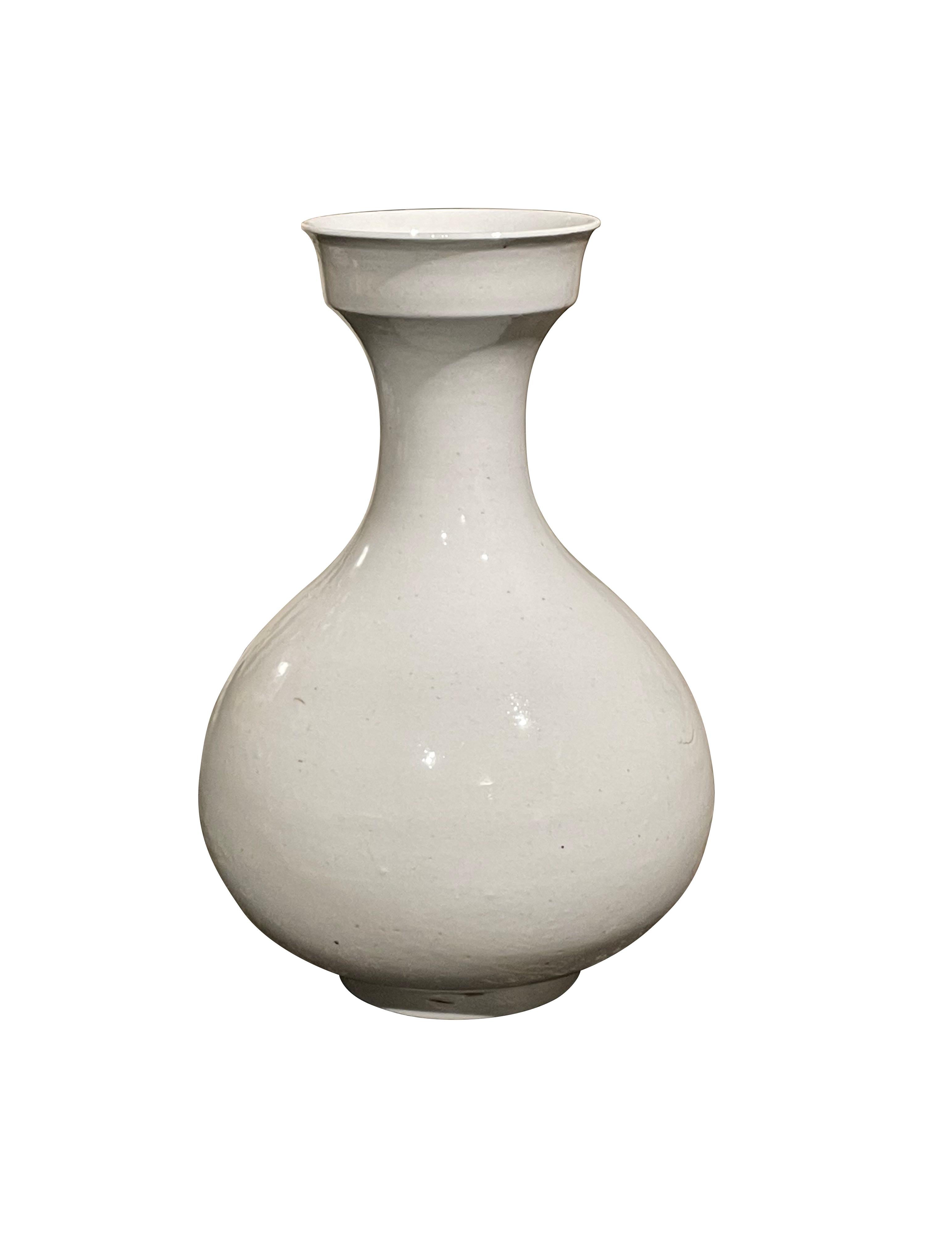 Contemporary Chinese white ceramic vase with decorative cup shaped top.
Part of a large collection of white vases.
 
