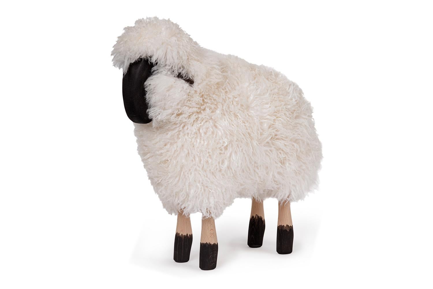 White curly haired small sheep

This small sheep with curly white fur, painted and natural wood and dark leather ears is suitable as original seating, ottoman or for decoration. Use as a stool for example, around a dining table the back of the