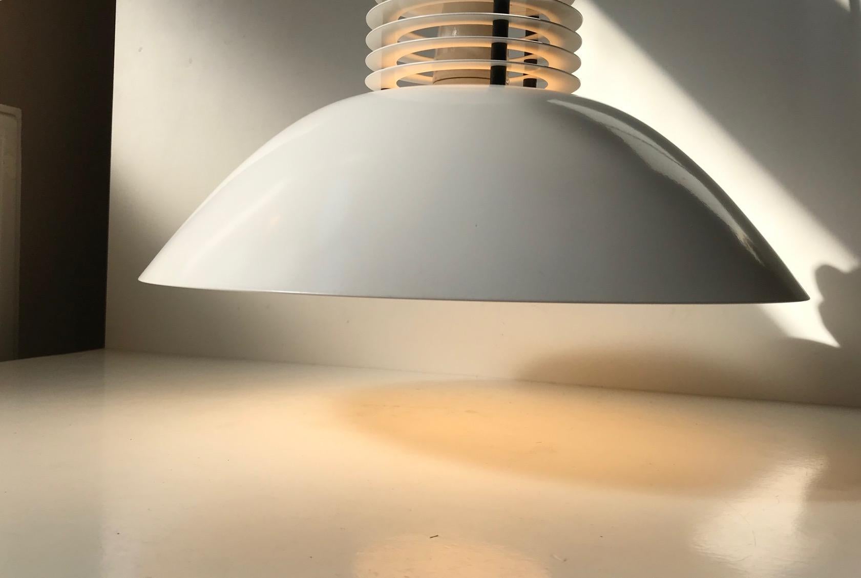 - White enameled and tiered ceiling light designed by Jorgen Buchwald in his series Lanterna Danica from the 1970s
- It features original porcelain fitting suitable for a up to 100 watts light bulb
- Makers mark is still present to the inside of