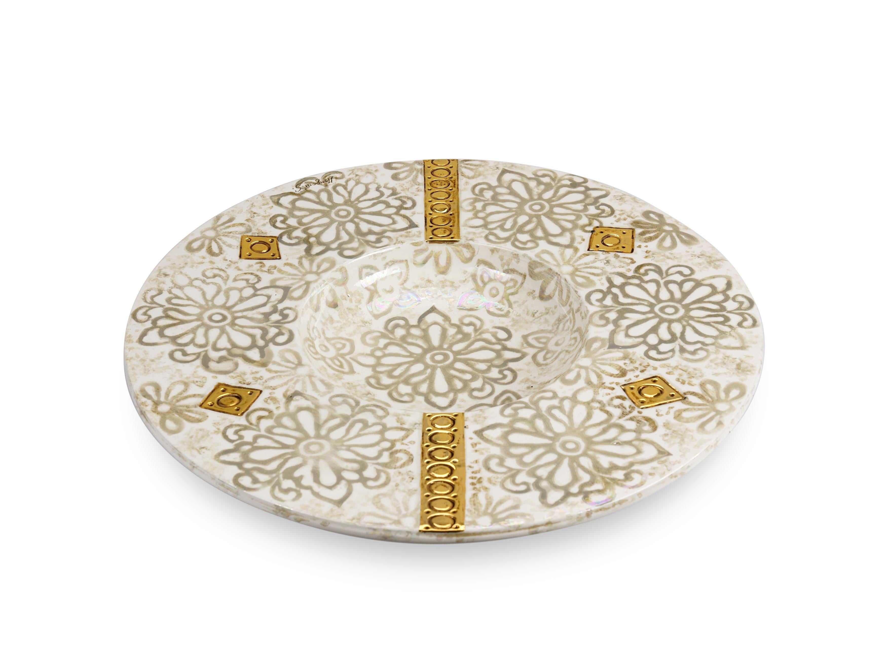 Large decorative ceramic plate made and hand painted by the artist G. Mengoni for deBlona. Diameter 64 cm (25.2 in). The surface of the plate is studded and decorated with ash-coloured floral motifs on an antique white background, the decoration are
