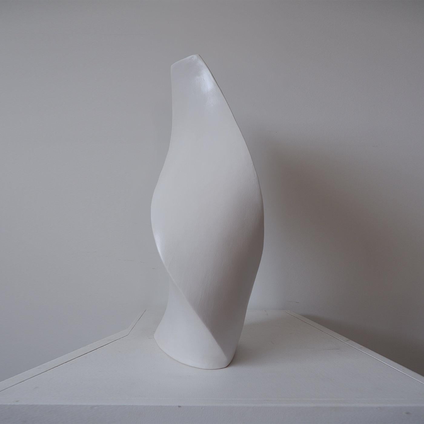 Demeter was the Greek goddess of fertility, the four seasons and the cycle of life. This sleek, white vase features a sinuous silhouette that is the perfect minimalist backdrop for any floral arrangement. The vase becomes a watery womb, holding the