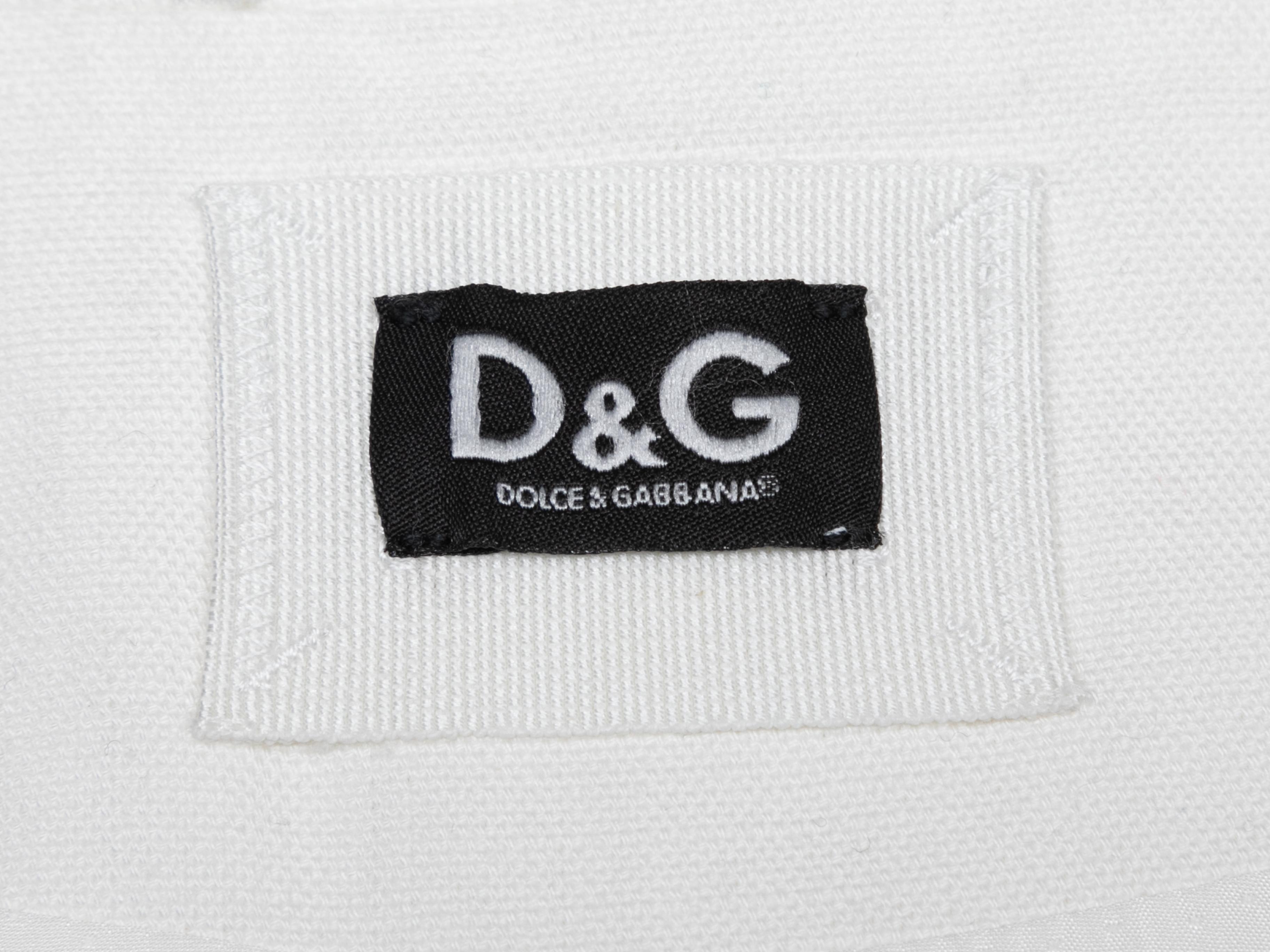 White cotton double-breasted trench coat by D&G. Notched lapel. Dual hip pockets. Button closures at front. 43