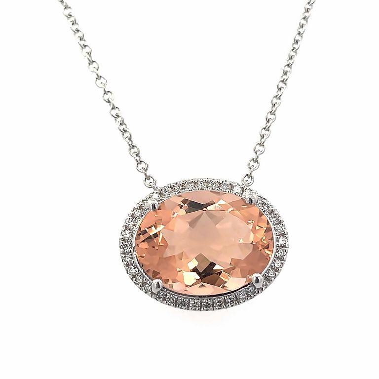 Introducing our stunning orange morganite stone necklace, the perfect accessory to add a pop of color and elegance to any outfit. It features an oval orange morganite color stone with a total weight of 8.05 carats, surrendered by round white