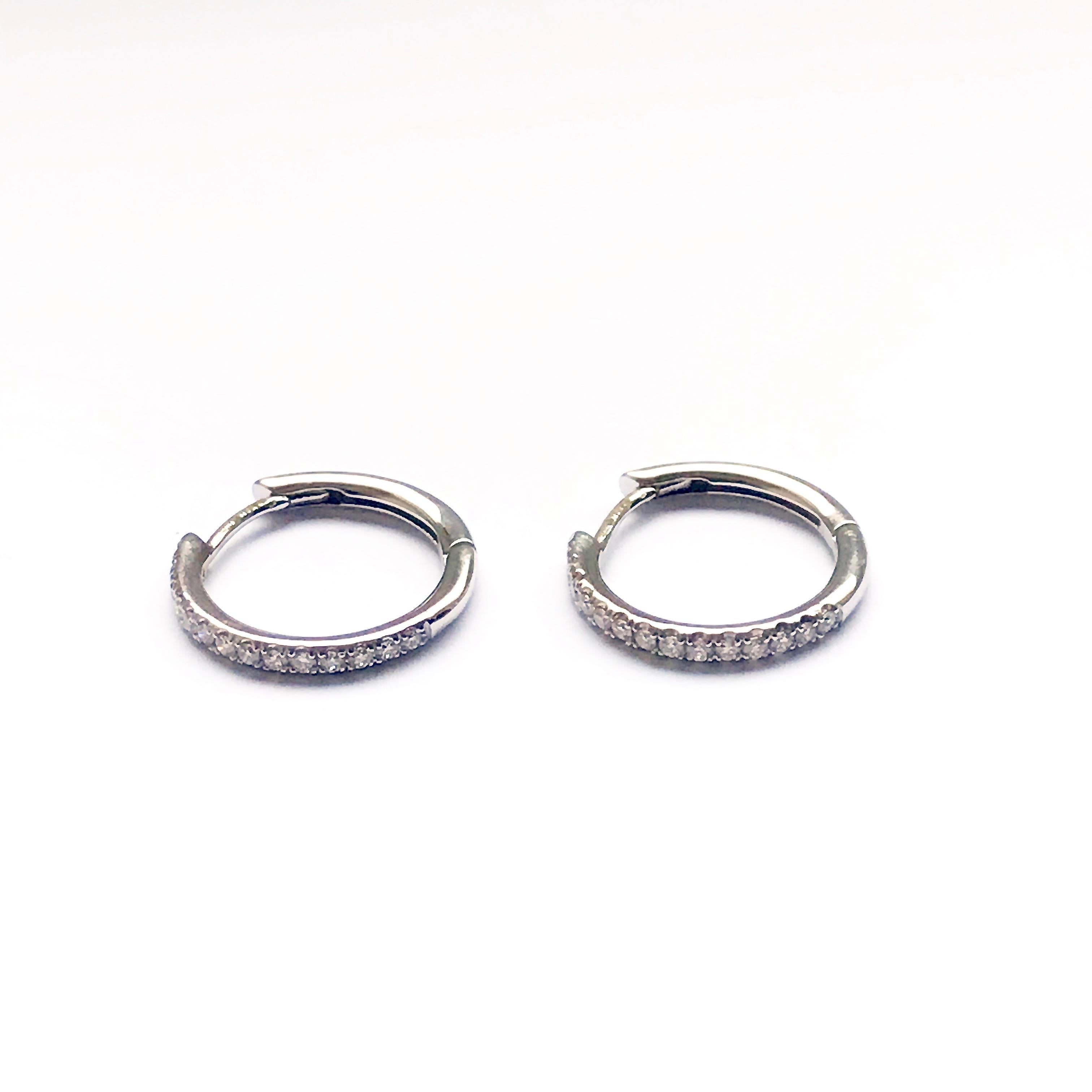 18 Karat solid white gold hoop earrings micro-set with high-quality white diamonds.
Timeless, easy to wear, gives a touch of elegance to any outfit appropriate for almost all occasions.
Gauge: 1.8mm
Width ( diameter) : 1.57cm
Gemstone: White