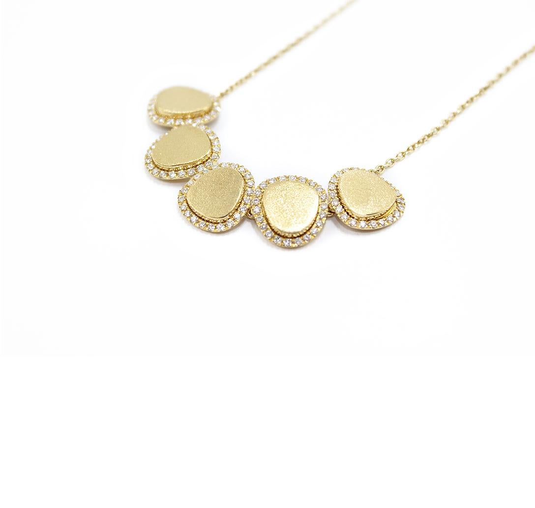 A very elegant necklace from our collection GRETA. 
Free shapes in satin 18kt yellow gold, white diamonds frame
Gold g. 9
White Diamonds ct. 0,69
