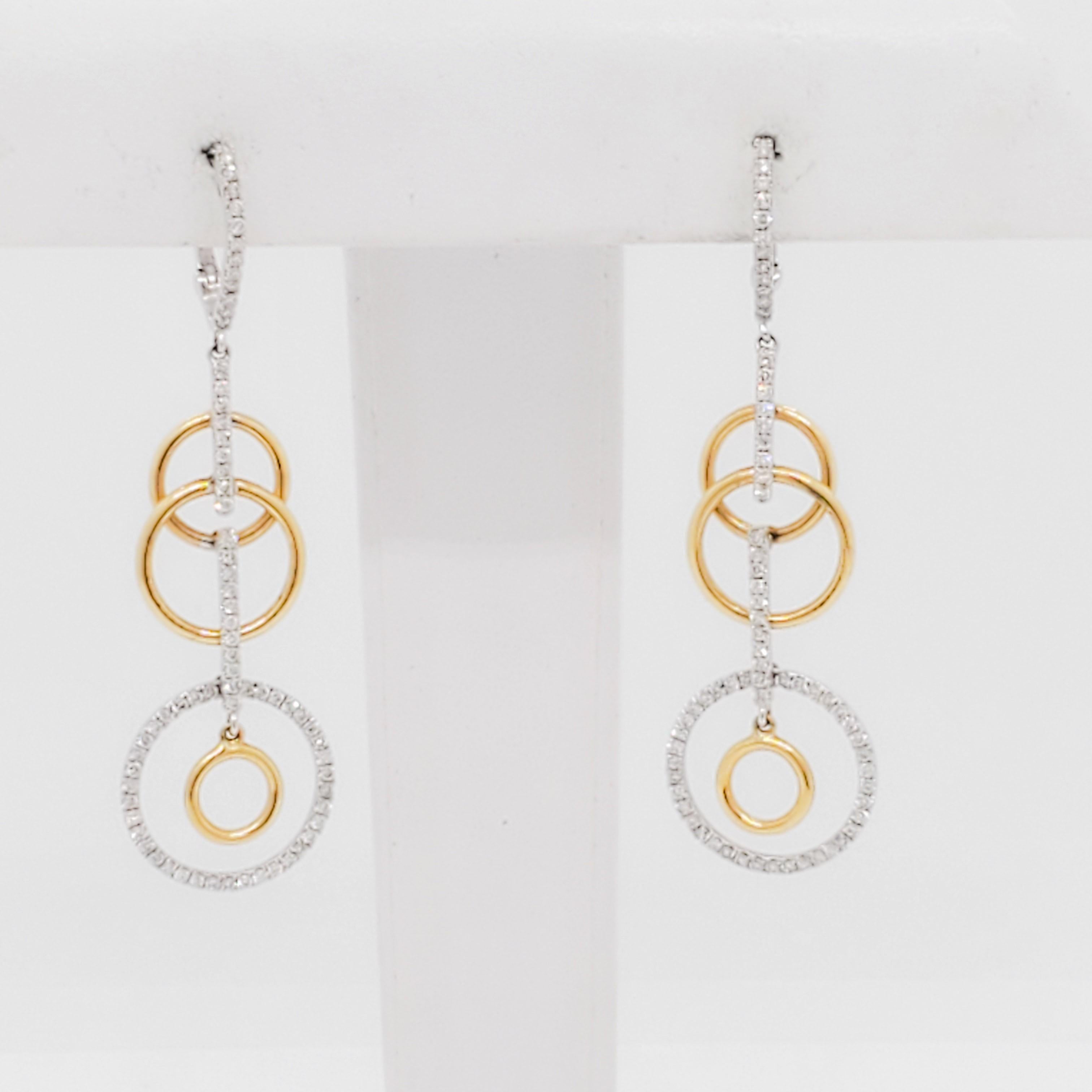 Bellissimi orecchini con diamanti bianchi rotondi di buona qualità da 0,73 ct. in cerchi multipli.  Realizzato a mano in oro bianco e giallo 14k.  Perfetto per ogni occasione e facile da indossare.