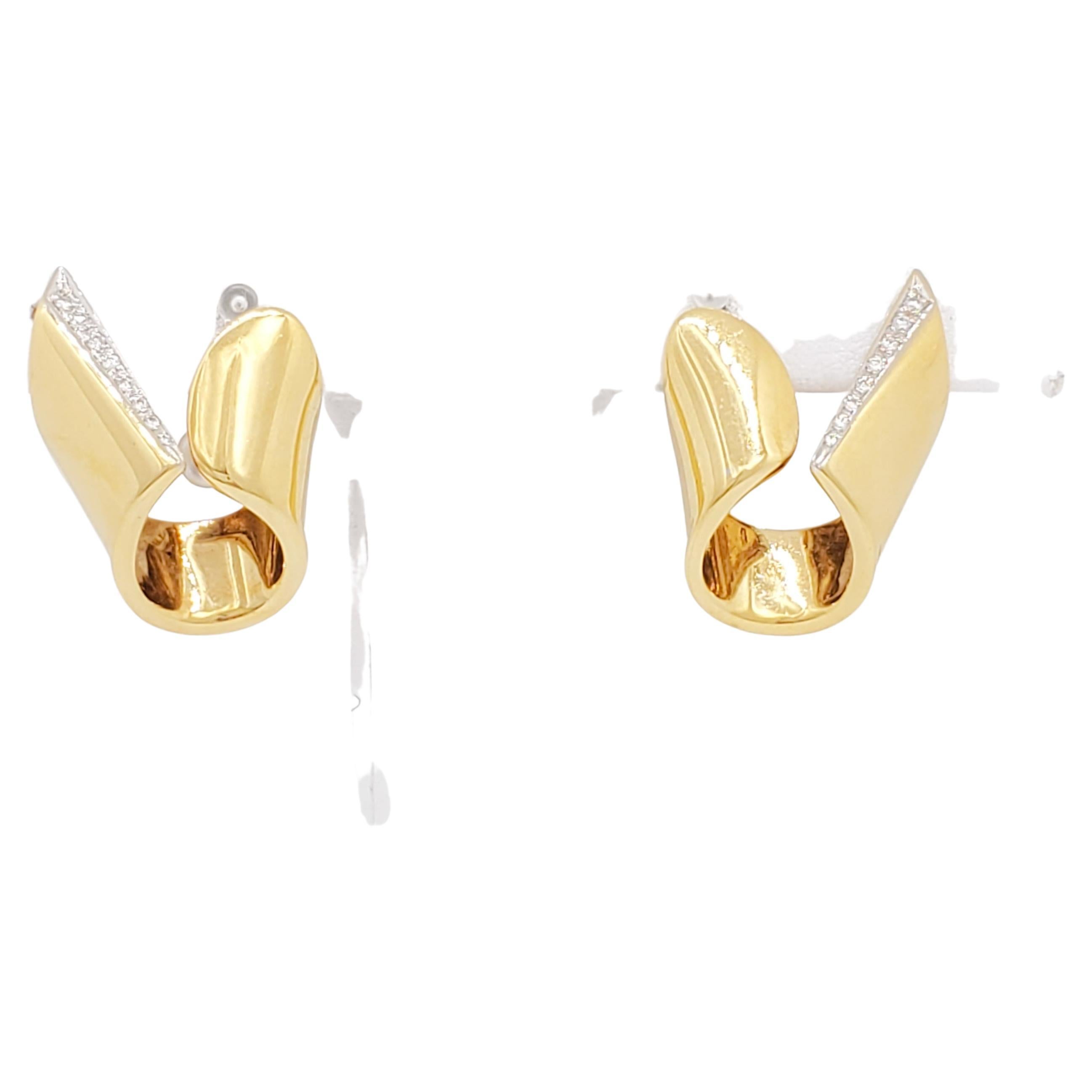Beautiful and eclectic earrings with 0.05 ct. white diamond rounds.  Handmade in 18k yellow gold.