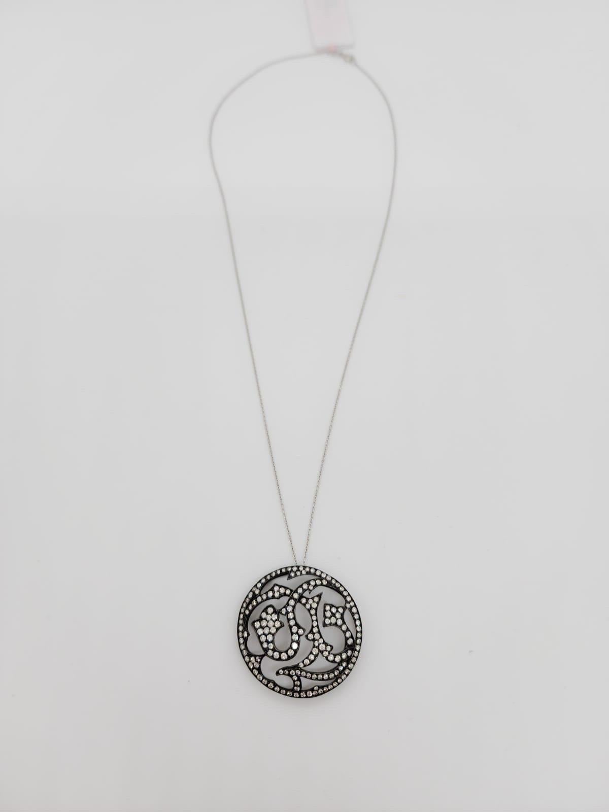 Beautiful 2.13 ct. white diamond rounds in this medallion pendant.  Handmade in 18k white gold with black rhodium.  Length is 18