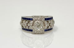 Anillo de Platino con Diamante Blanco y Zafiro Azul