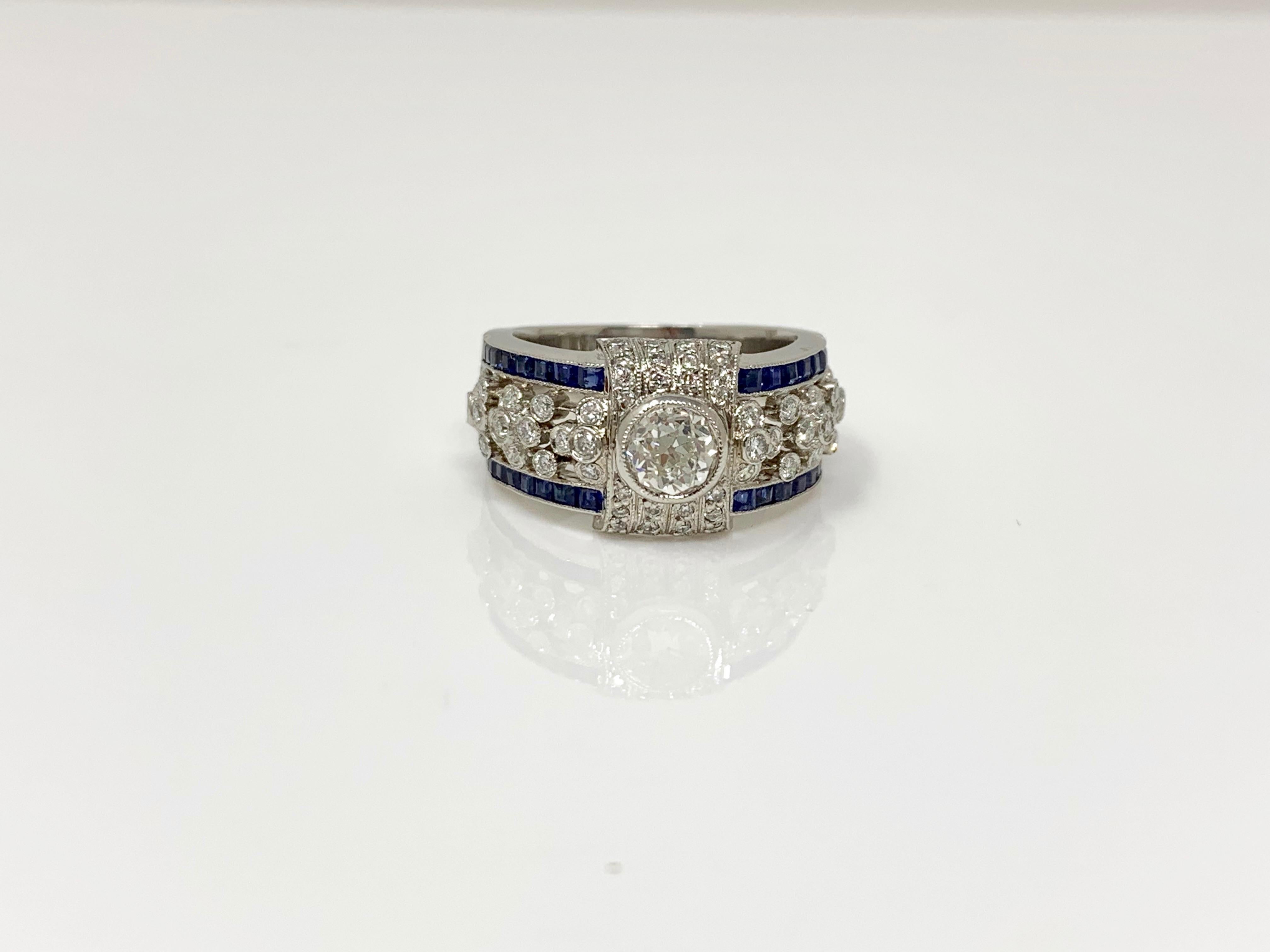 Contemporary White Diamond and Blue Sapphire Ring in Platinum For Sale