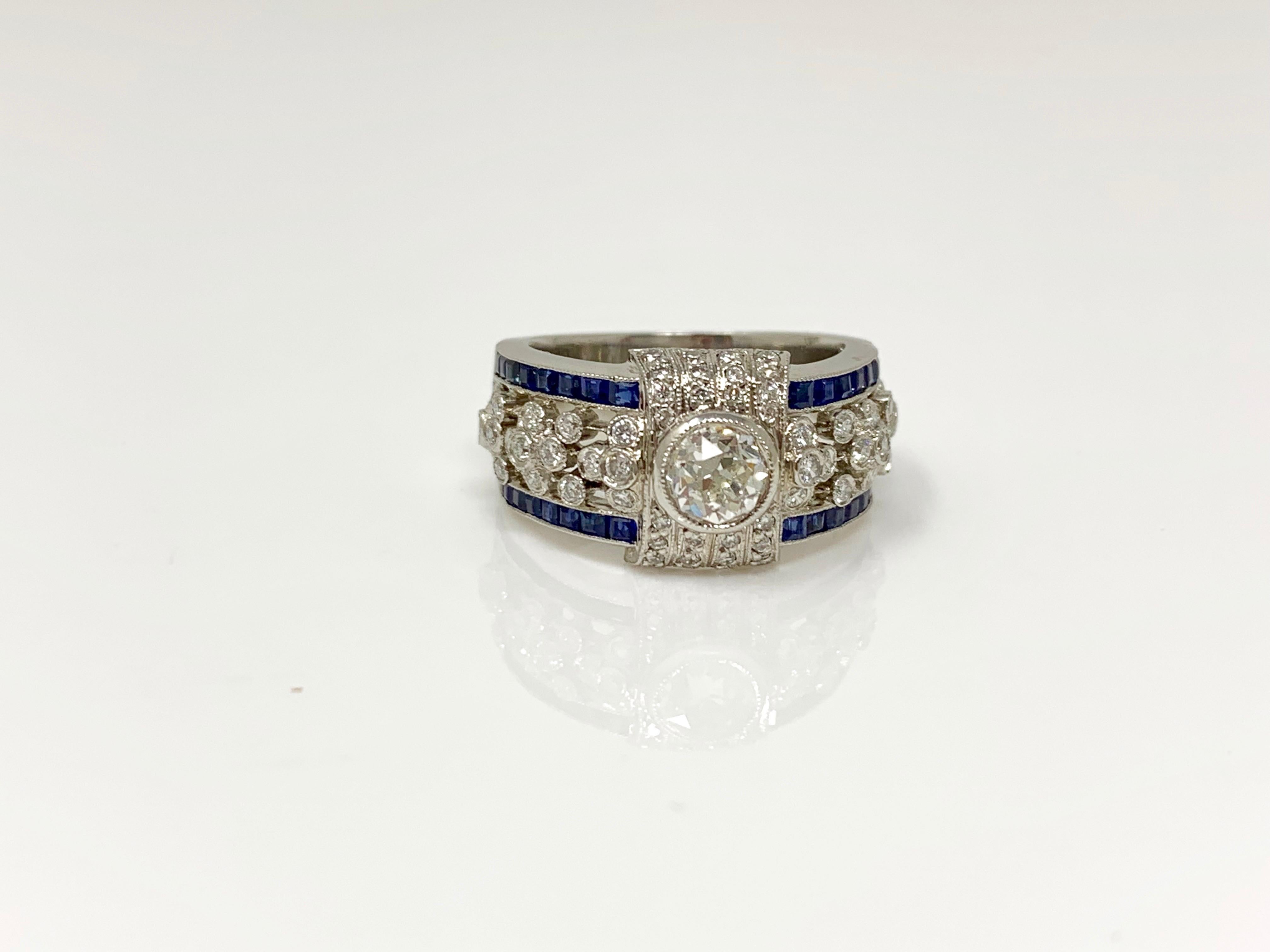 Round Cut White Diamond and Blue Sapphire Ring in Platinum For Sale