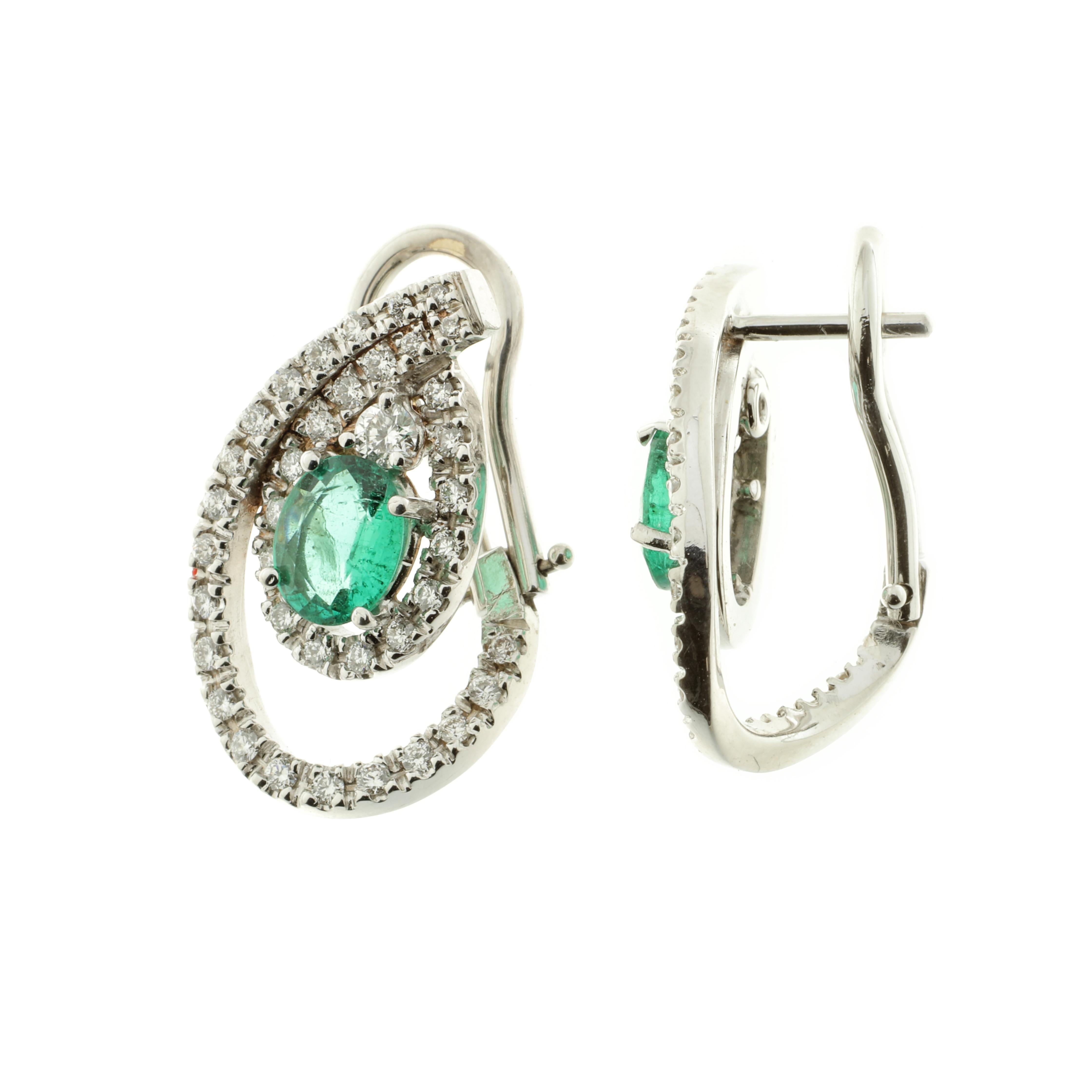 These beautiful pear-shaped earrings feature 18-karat white gold, white diamonds (rated G VS) and emeralds. Hand-made using traditional methods, this singular piece has been designed and produced in Palermo, Sicily by master jewellers. 

The