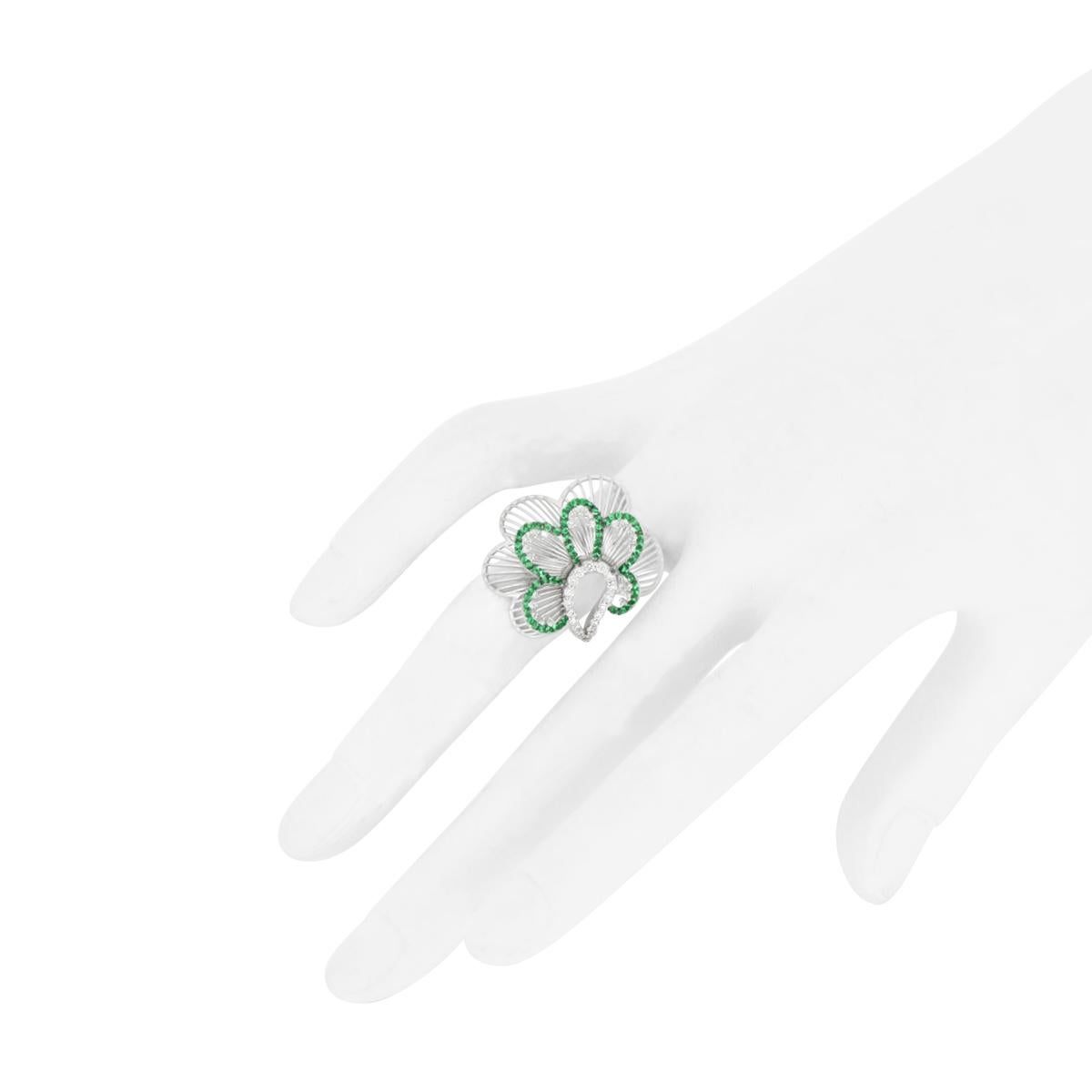 Artisan White diamond and emerald modern fashion flower ring in 18kt white gold For Sale