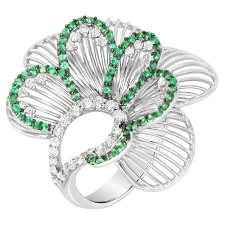 White diamond and emerald modern fashion flower ring in 18kt white gold For Sale