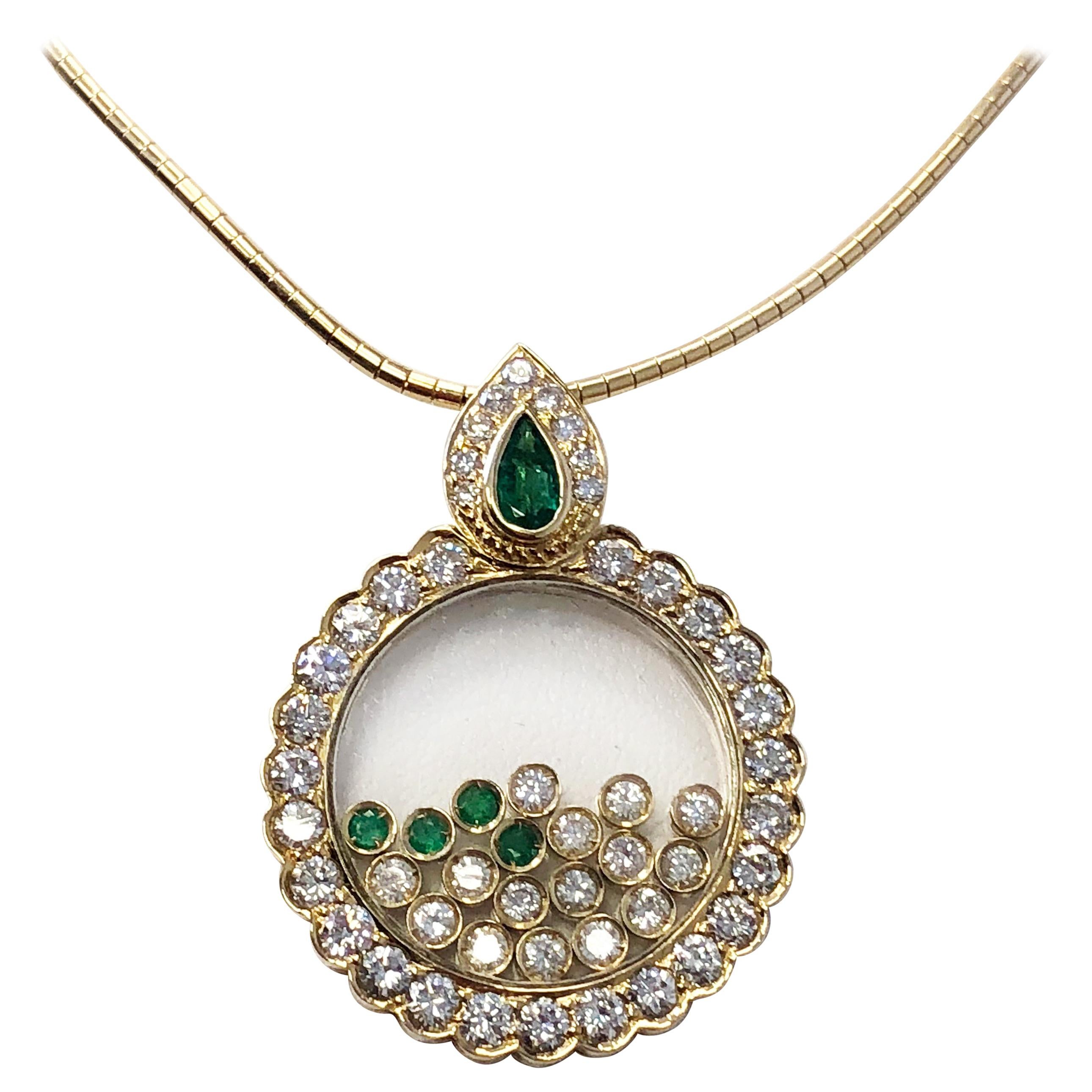 White Diamond and Emerald Movement Necklace in 18 Karat Yellow Gold