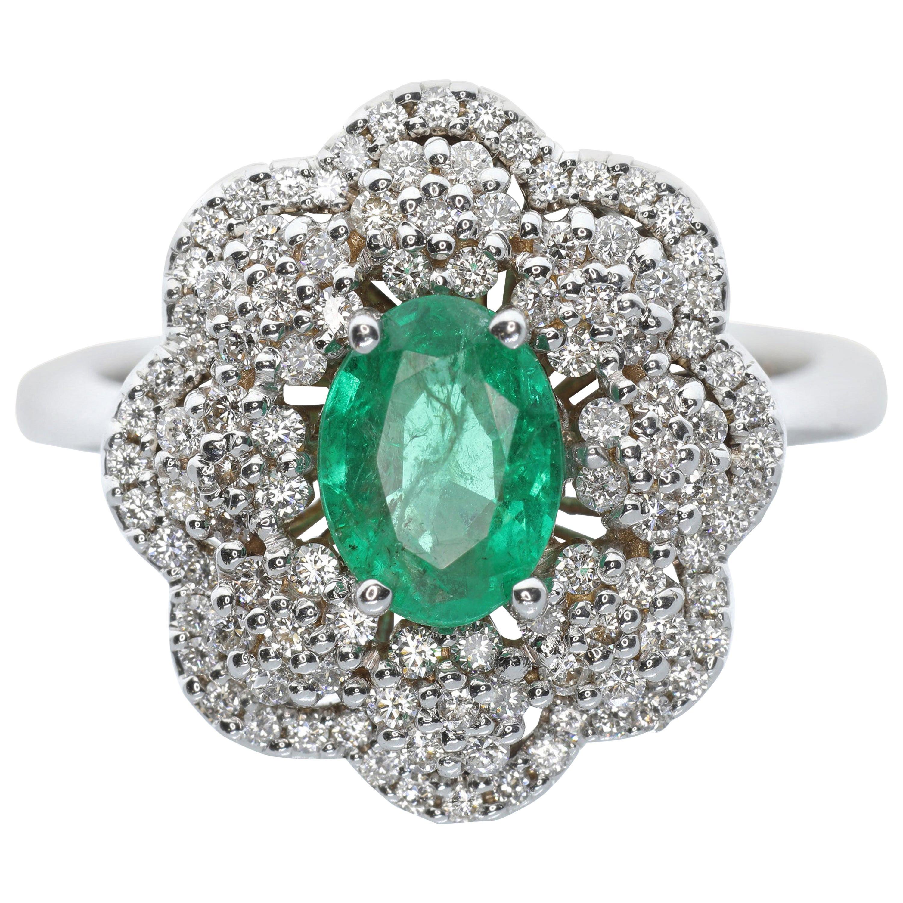 21st Century 18 Karat White Gold White Diamond and Emerald Flower Cocktail Ring