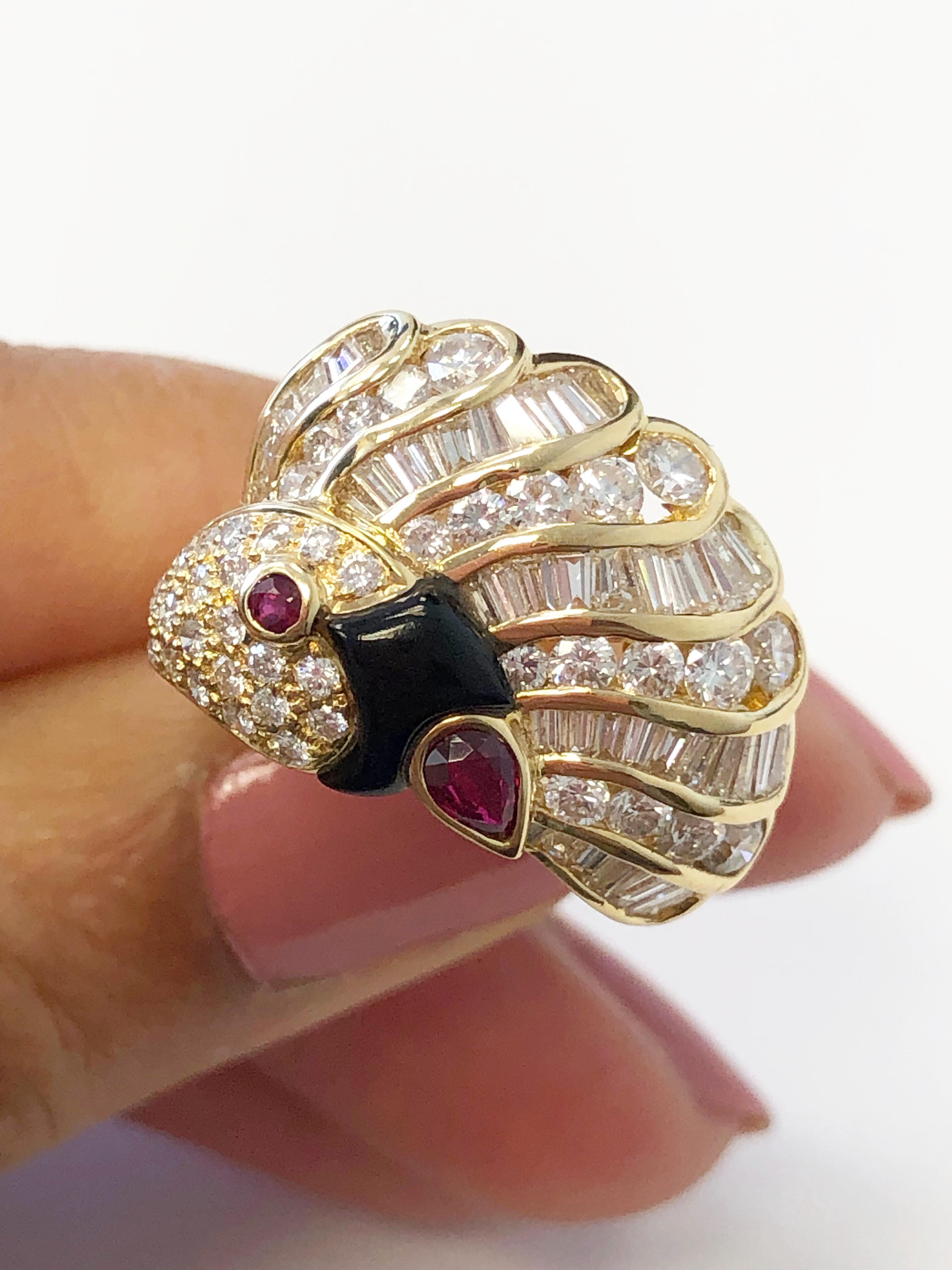 Stunning 1.15 carat good quality white diamond rounds and baguettes with 0.15 carats of ruby pear and round.  Onyx detailing and unique peacock design handcrafted in 18k yellow gold in size 6.5.  Such a fun piece to add to any collection!
 