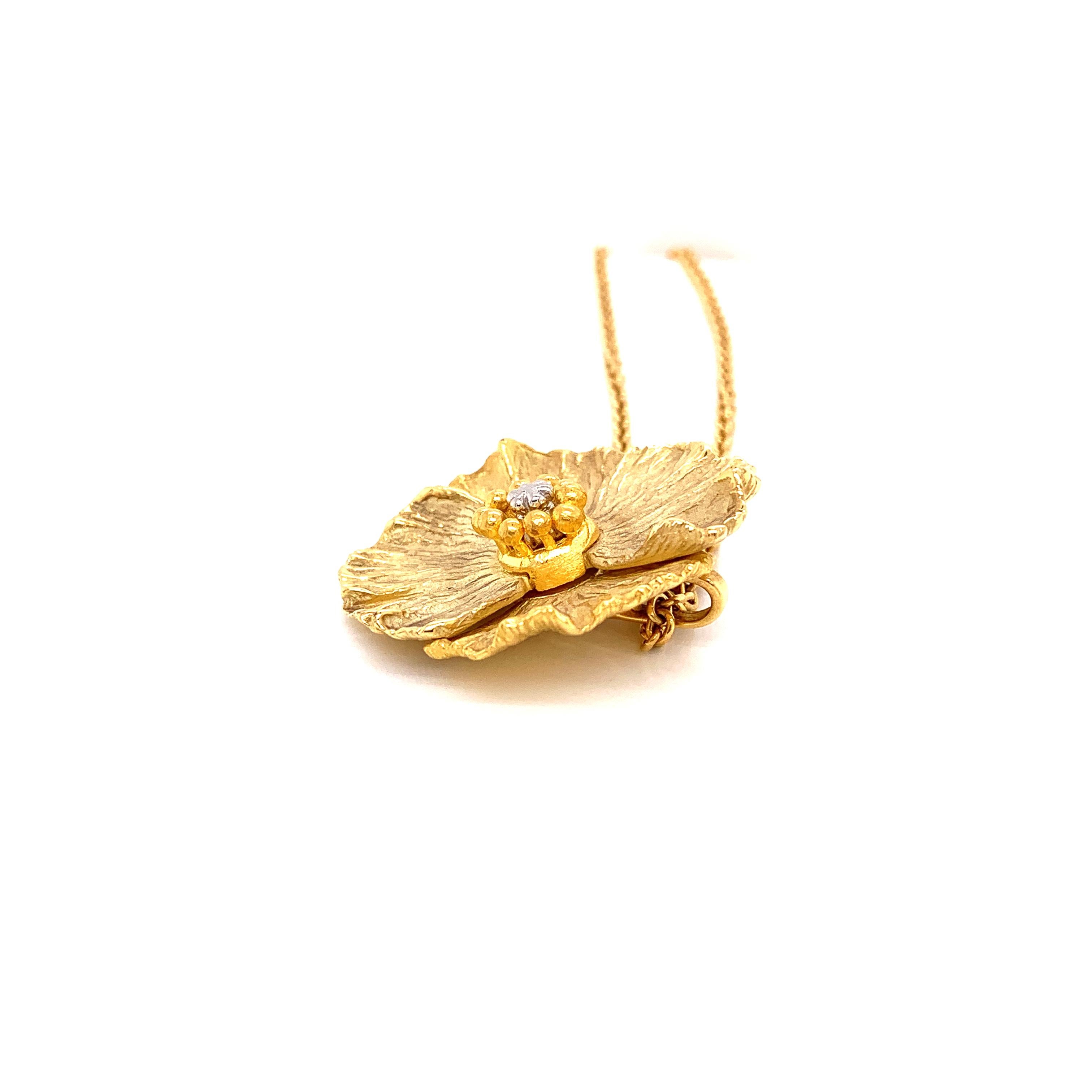 gold hibiscus pendant
