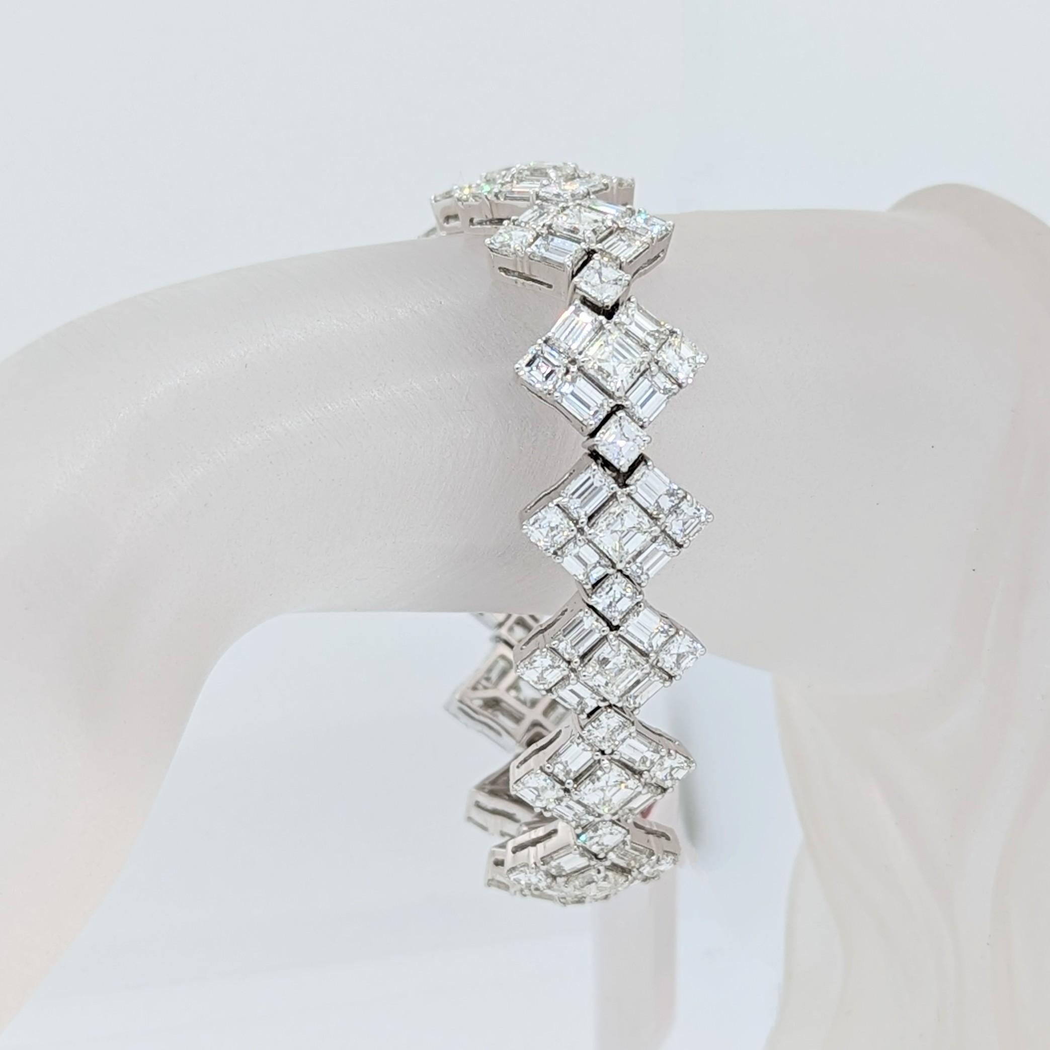 Absolutely stunning 28.46 ct. good quality, white, and bright asscher and emerald cut diamonds (120 stones) handmade in 18k white gold.  Length of bracelet is 7
