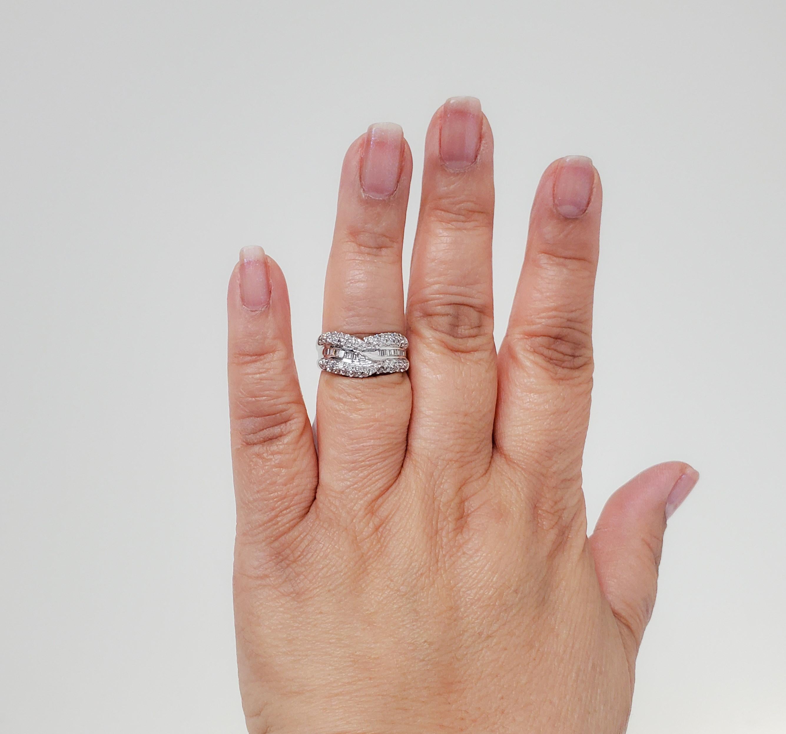 Beautiful 1.00 ct. good quality white diamond baguettes and rounds.  Handmade in 14k white gold.  Ring size 7.