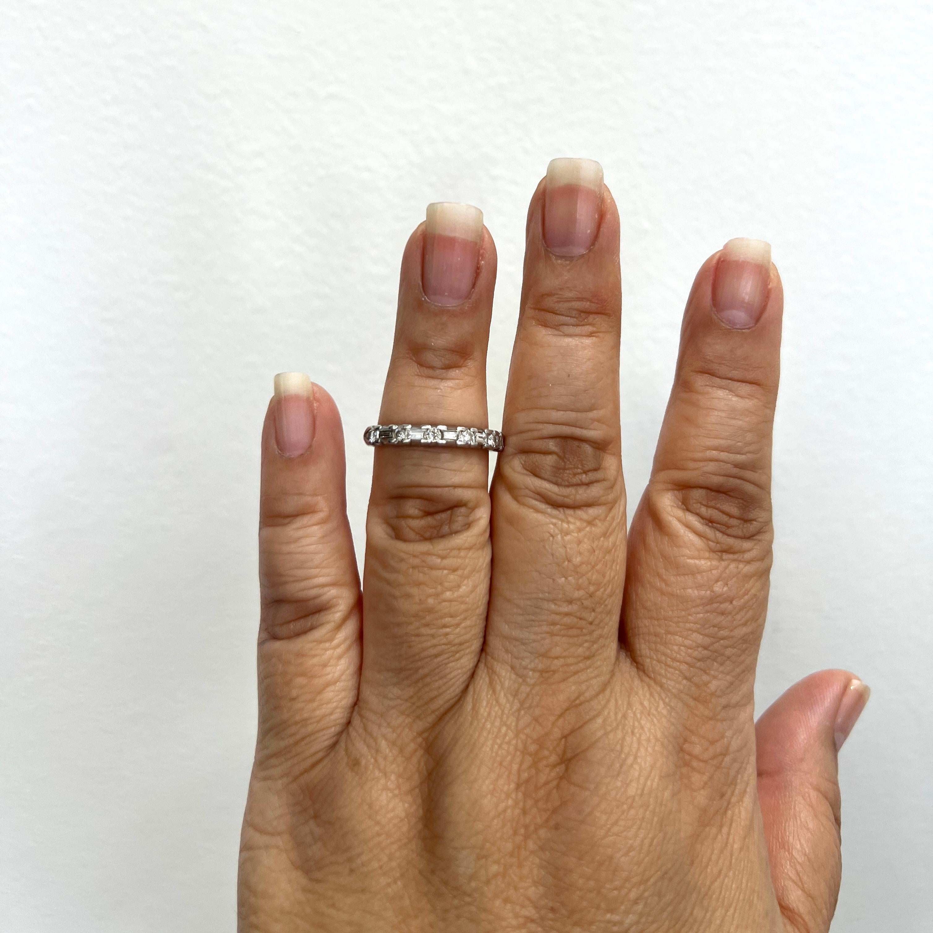 Beautiful band with good quality white diamond baguettes and rounds.  Handmade in platinum.  Ring size 9.