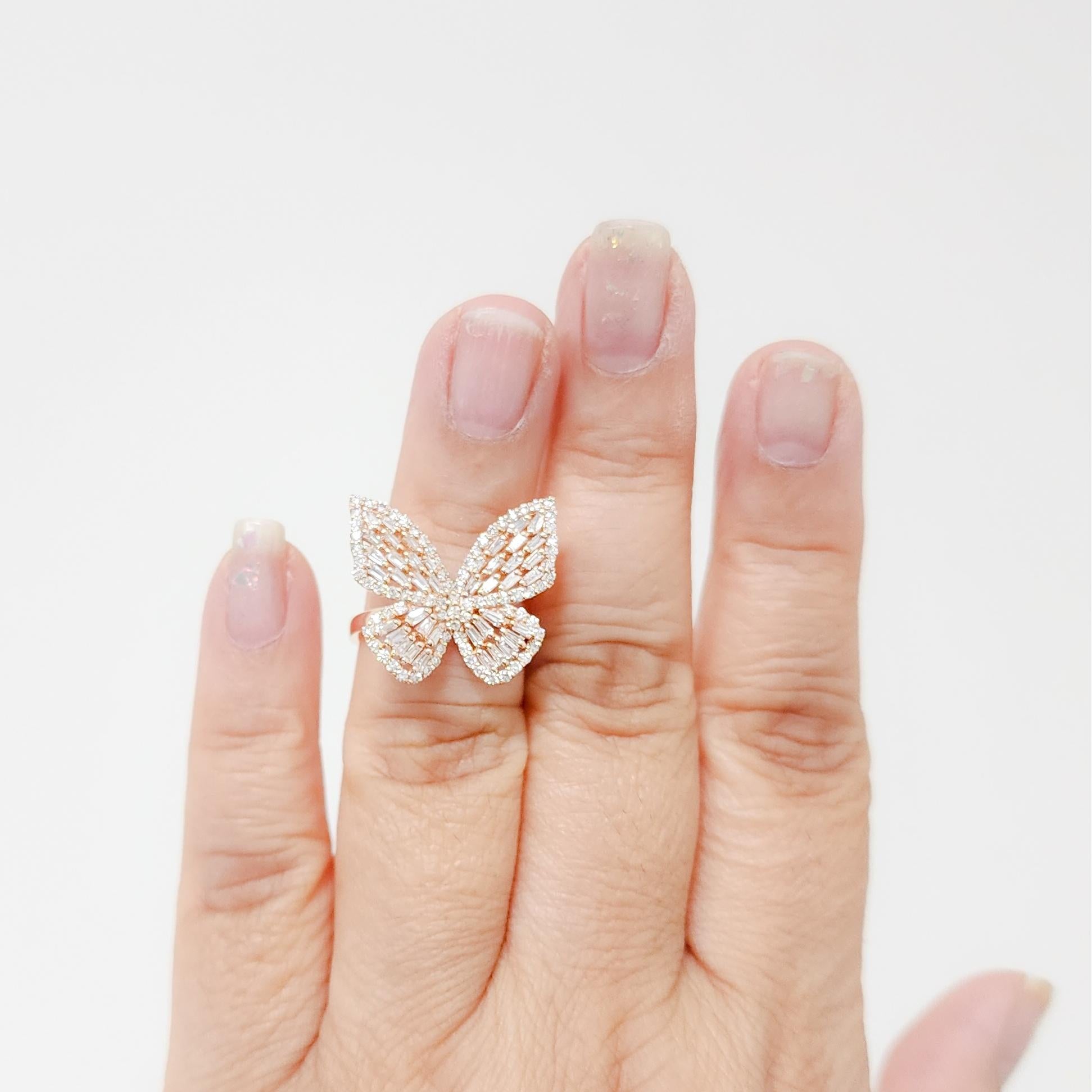Absolutely stunning 1.33 ct. white diamond baguette and round butterfly design ring.  This ring is handmade in 14k rose gold with attention to great detail.  It's a fun and frivolous piece.  Ring size 6.75.  Comes in white and yellow gold as well. 