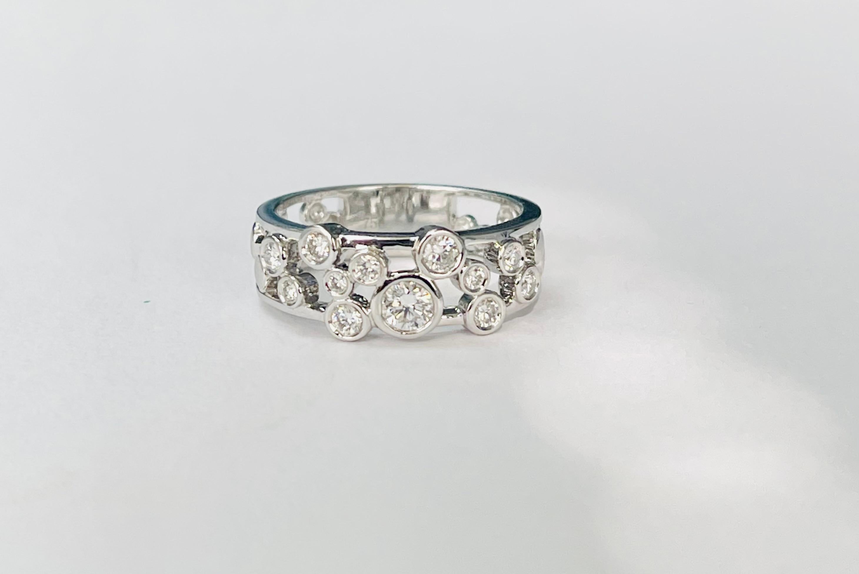 White diamond band beautifully designed and hand crafted in 18k white gold. 

The details are as follows; 

Diamond weight : 0.50 carat ( G color and VS clarity ) 
Metal : 18k white gold 
Ring size : 6 1/2 
