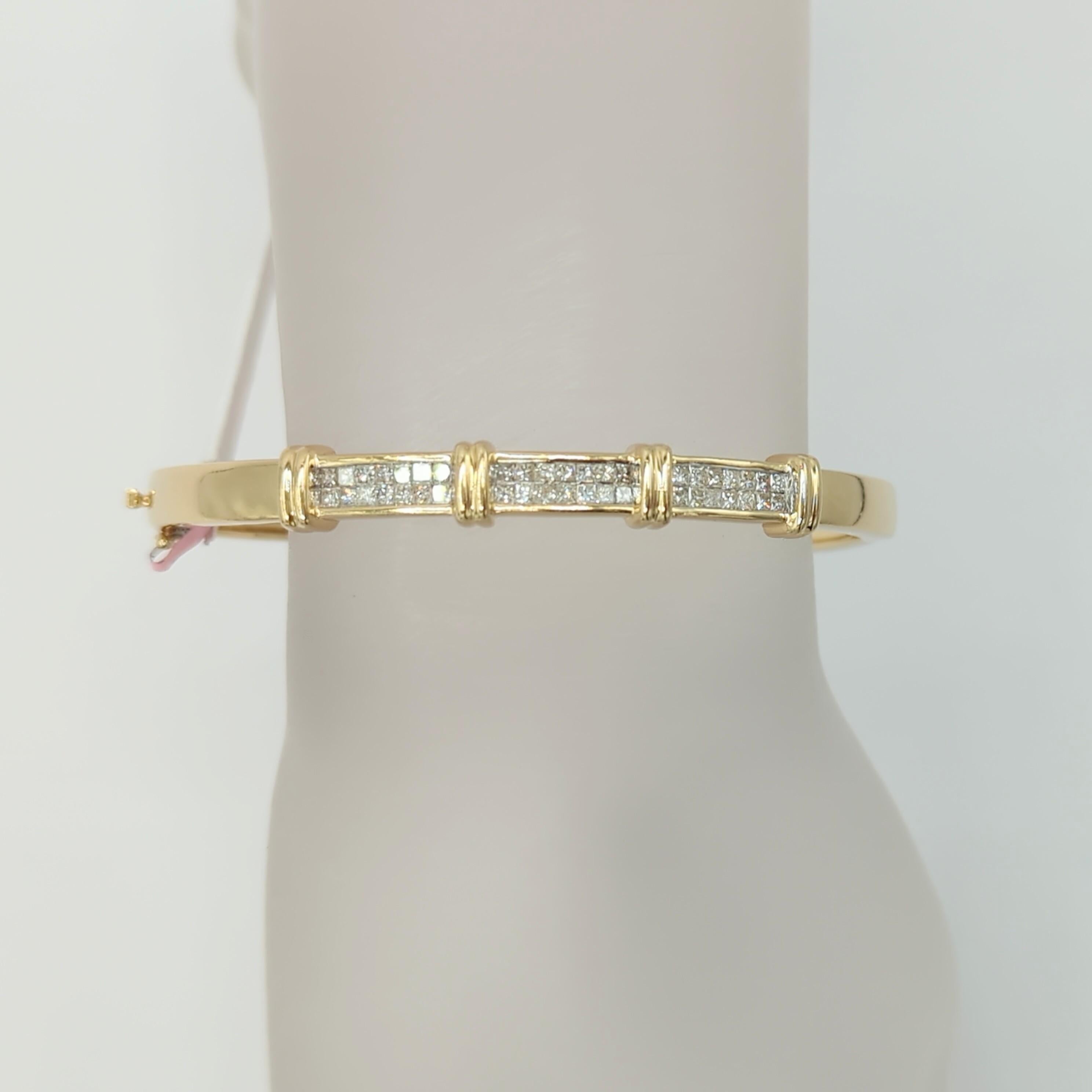 Beautiful 2.50 ct. white diamond princess cuts handmade in 14k yellow gold.  This is a great bangle to stack with a watch, other bracelets/bangles, or to wear on it's own.