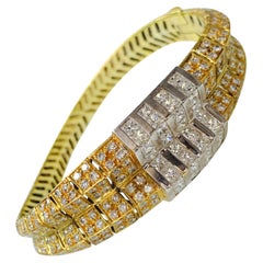 White Diamond Bangle in 18 Karat Yellow and White Gold. White Diamond Bangle in 18 Karat Yellow and White Gold.