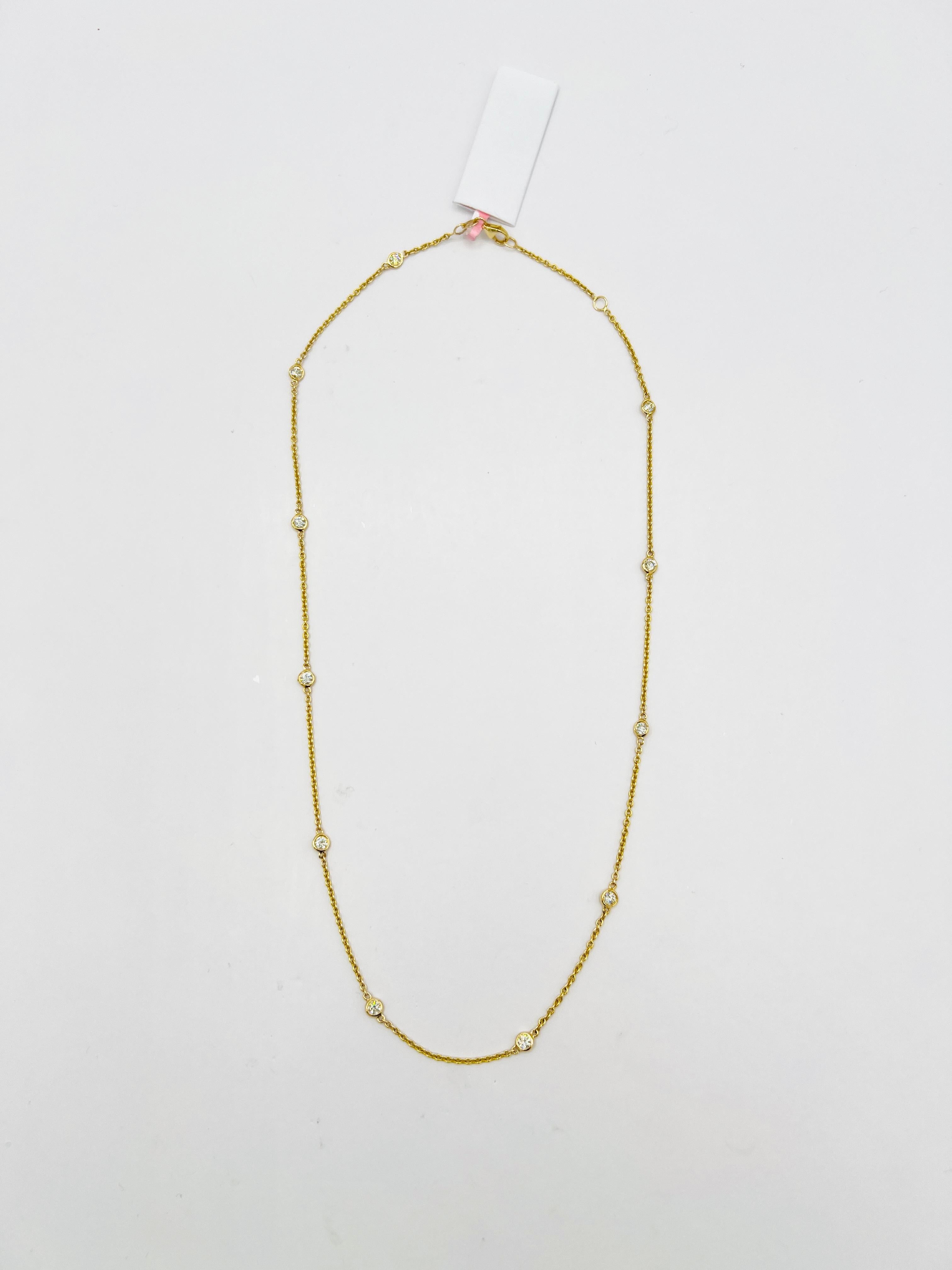 Beautiful necklace with 1.00 ct. of good quality, white, and bright diamond rounds.  Total of 11 stones.  Handmade in 14k yellow gold.  Length is 18