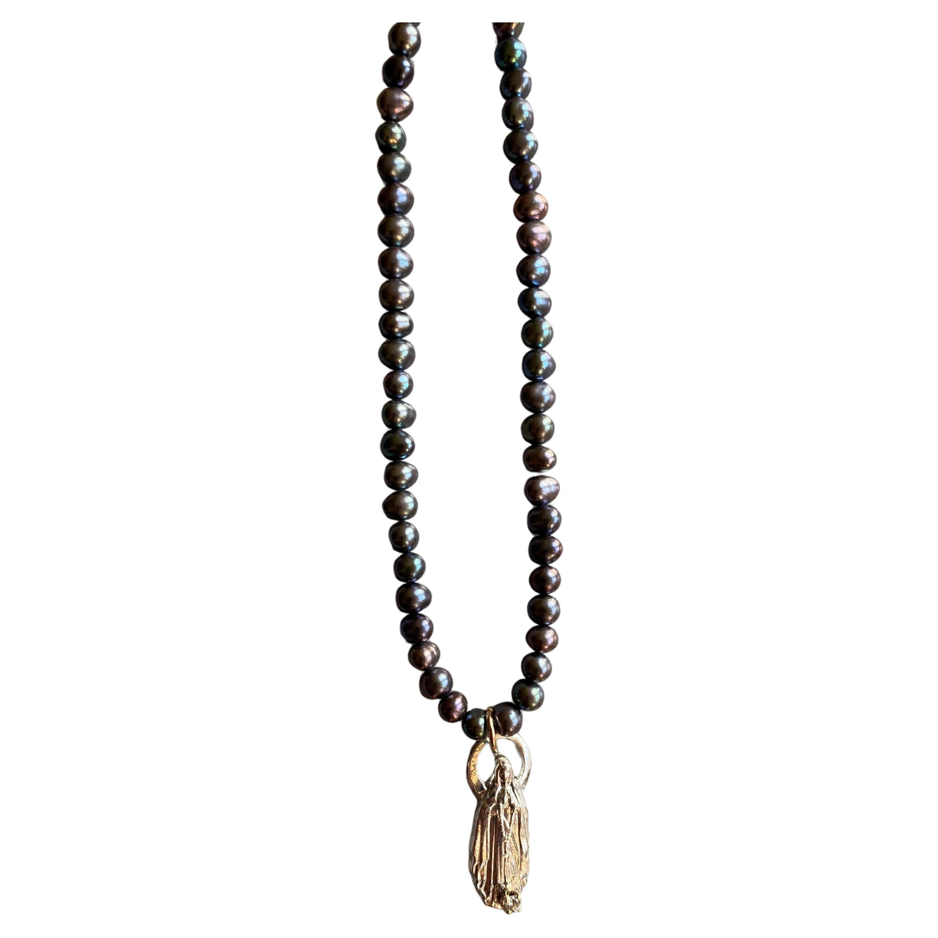 White Diamond Black Pearl Choker Necklace Virgin Mary Figurine Pendant

Designer:  J Dauphin

Exclusive piece with Virgin Mary pendant and an White Diamond set in a gold prong on a Silver Figurine pendant. Bead Necklace is 18' long but can be made