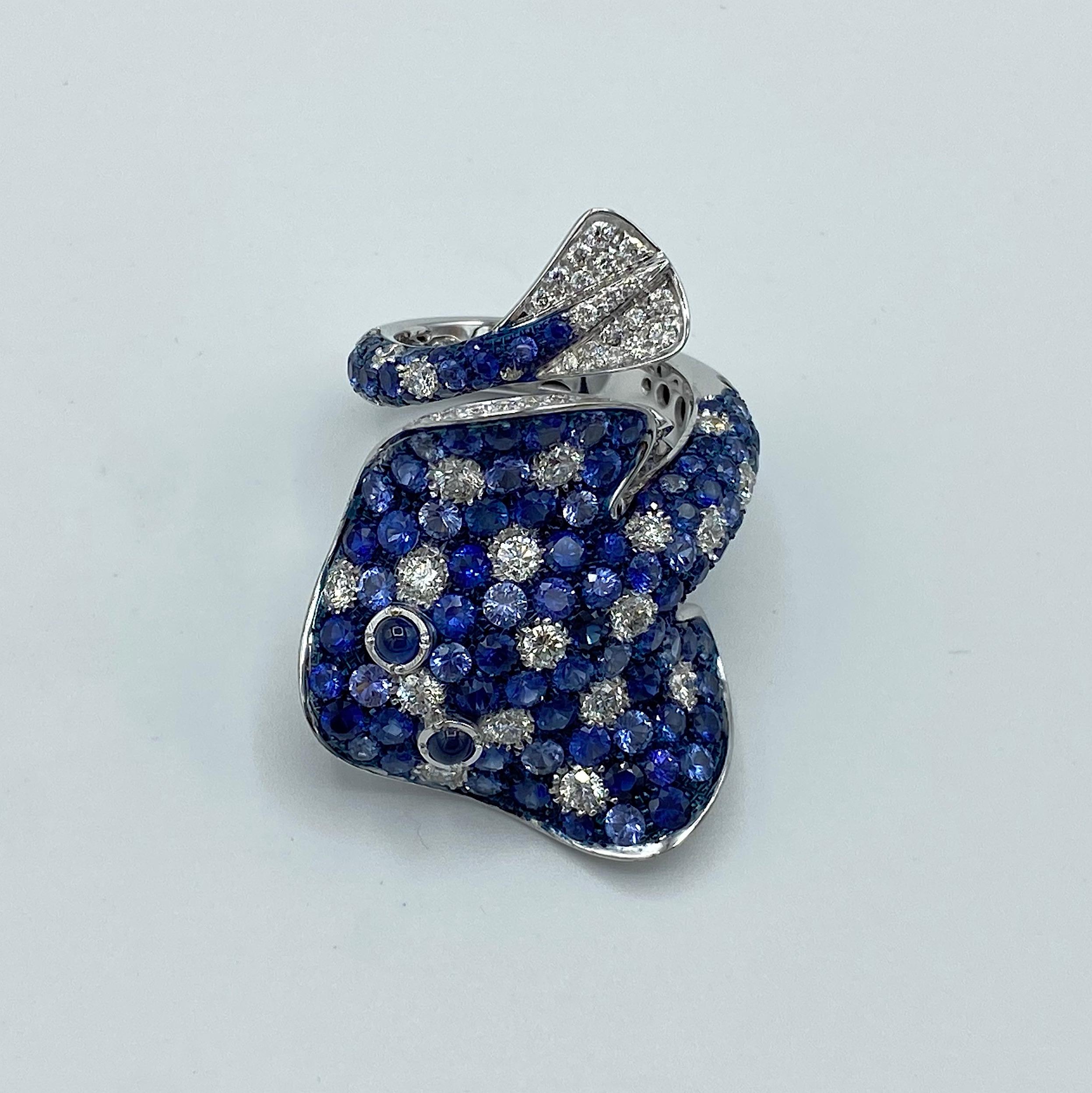 Ray Fish White Diamond Blue Sapphire 18 Karat Gold Ring Made in Italy 
I drew inspiration from the Spotted Eagle Ray which is found in tropical waters and its distinguished by its spotted and ringed back. I created the ring in my workshop near