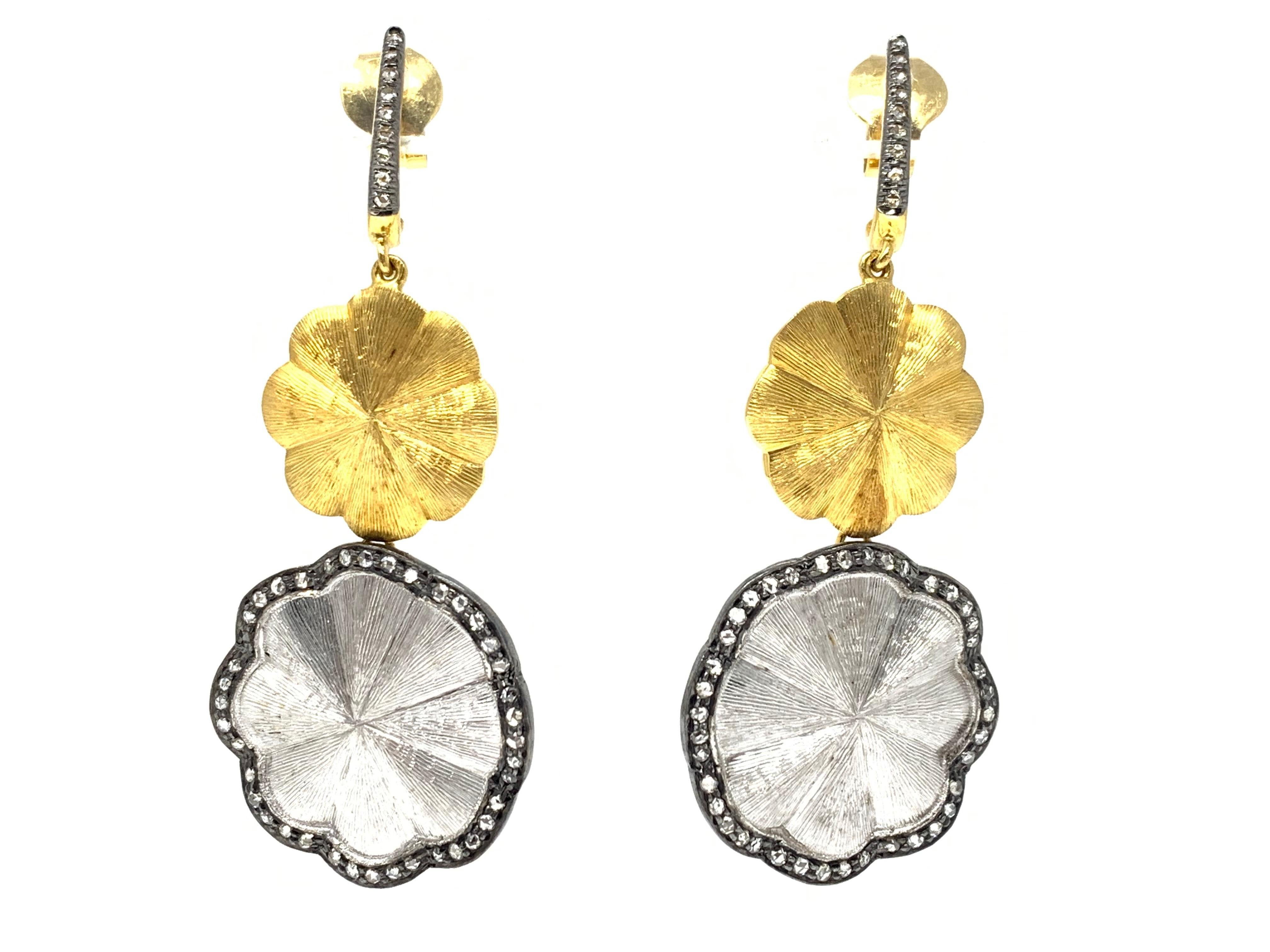These attractive and beautifully designed earrings by Moguldiam Inc are hand crafted in 18 k white and yellow gold. 
white diamond weight : 1.10 carat 
Metal : 18K white and yellow gold 
Measurements : 2 1/2 inches long 
yellow gold motive : 3/4  by