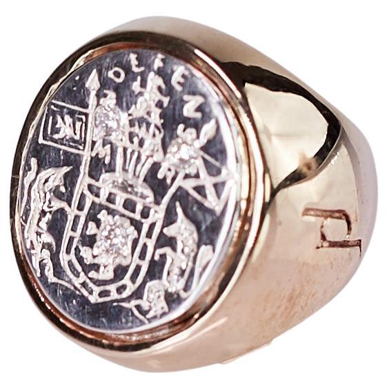 3 Pcz White Diamond Crest Signet Ring 14k Yellow and White Gold Unisex J Dauphin 

Inspired by Queen Mary of Scots ring. Gold signet-ring; engraved; shoulders ornamented with flowers and leaves. Oval bezel set with silver intaglio depicting