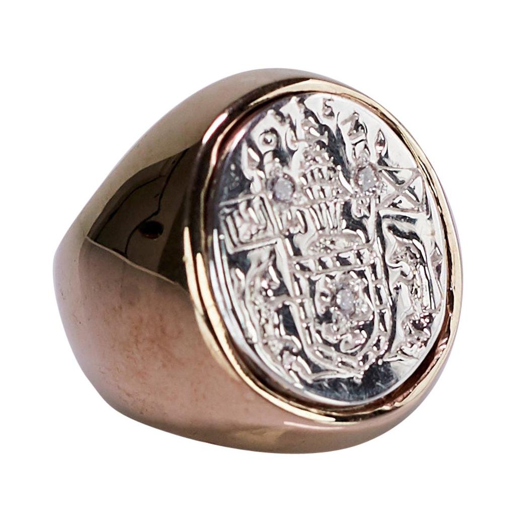White Diamond Crest Signet Ring 14k Yellow and White Gold Unisex J Dauphin 

Inspired by Queen Mary of Scots ring. Gold signet-ring; engraved; shoulders ornamented with flowers and leaves. Oval bezel set with silver intaglio depicting achievement of