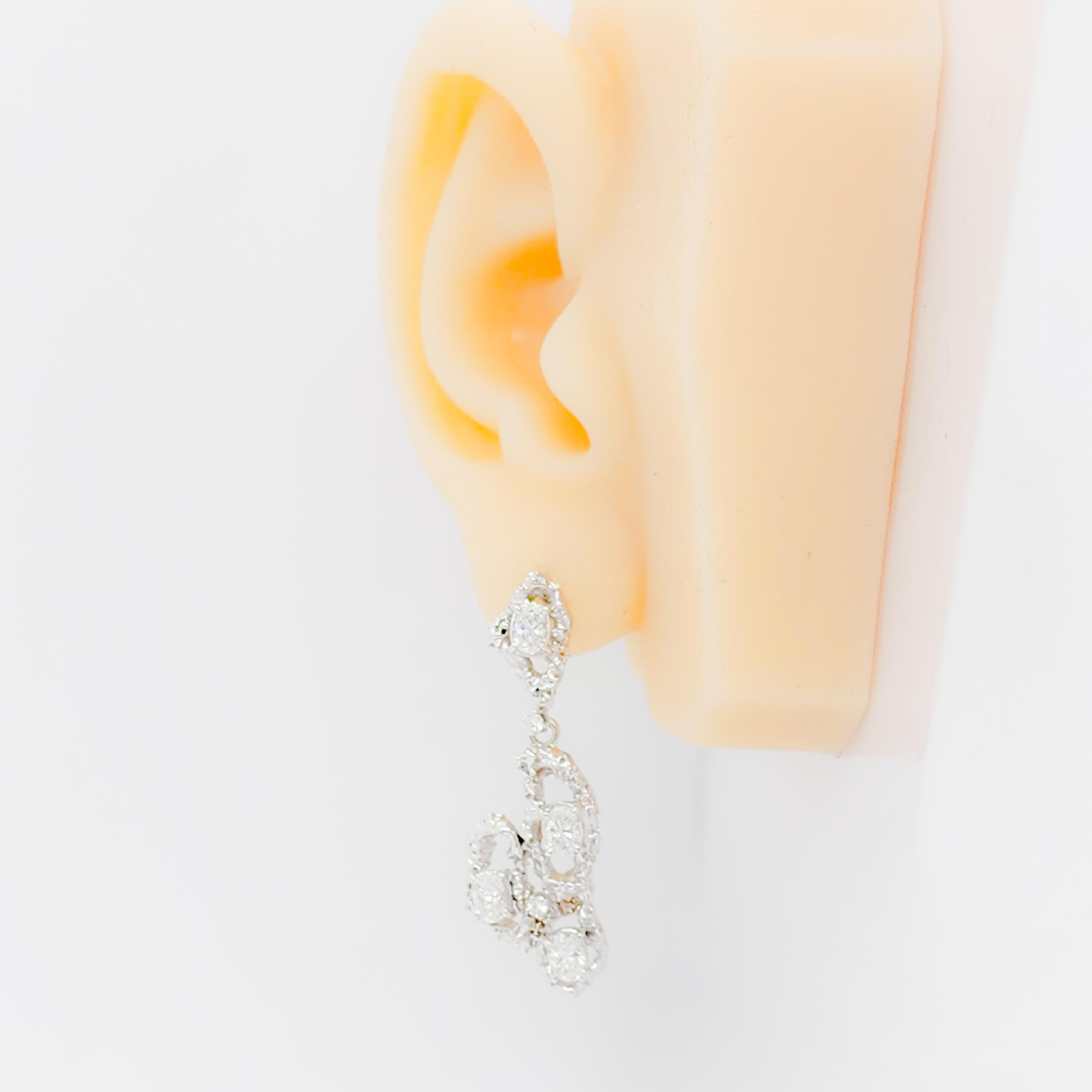 Beautiful 3.00 ct. good quality white diamond ovals and rounds.  Handmade in 18k white gold.  A great pair of earrings that can dress up any outfit.