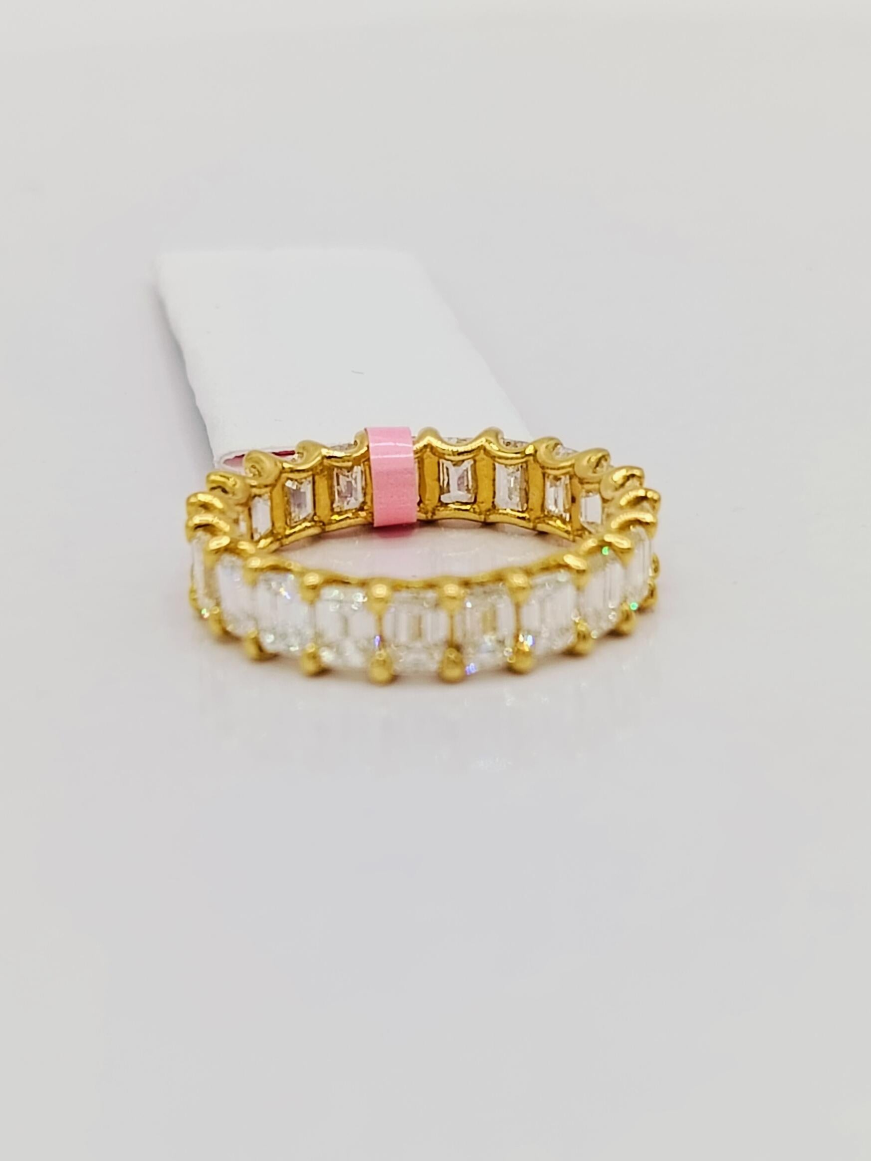 White Diamond Emerald Cut Eternity Band Ring in 18K Yellow Gold For Sale 1