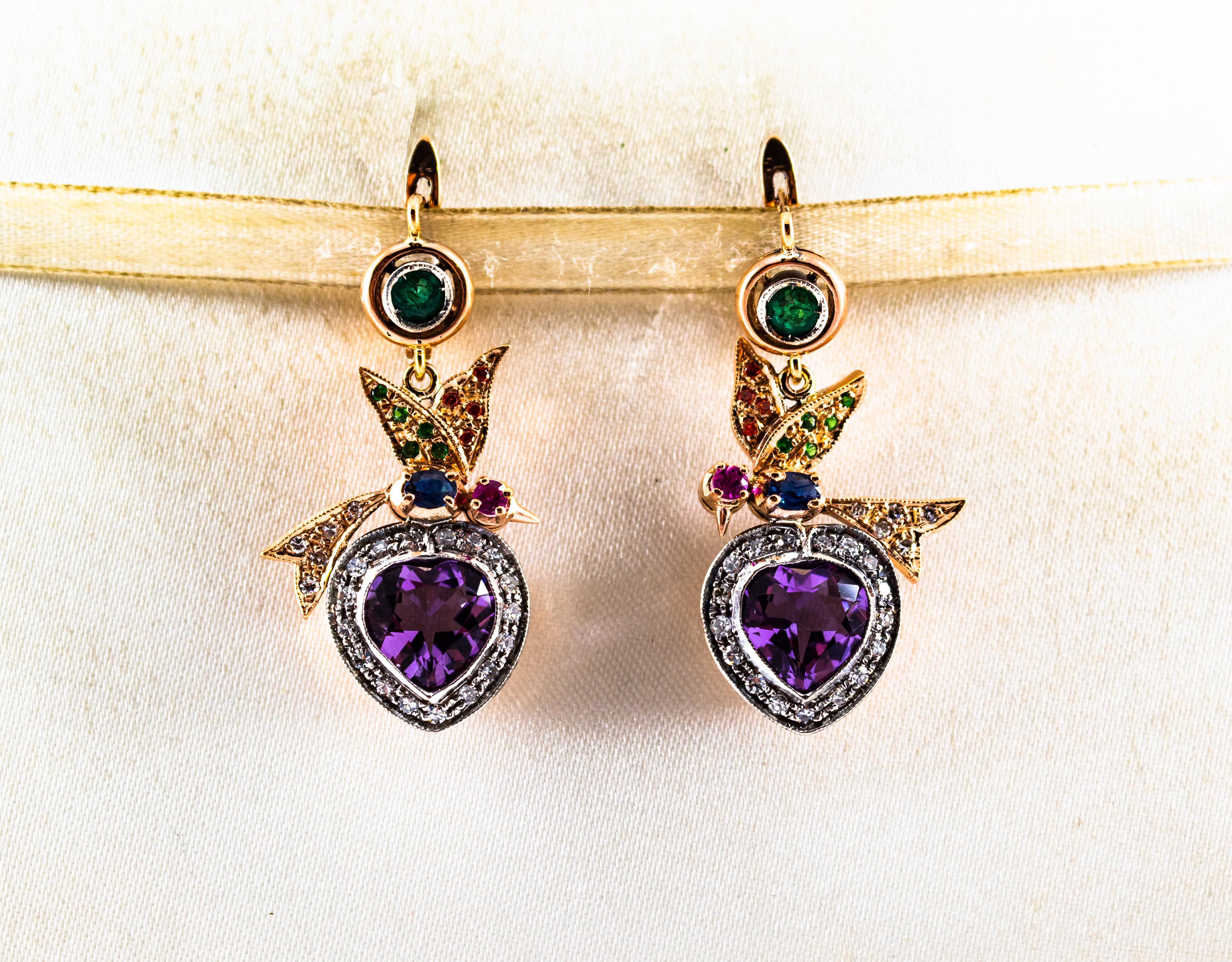 These Lever-Back Earrings are made of 9K Yellow Gold and Sterling Silver.
These Earrings have 0.55 Carats of White Diamonds.
These Earrings have 0.40 Carat of Emeralds.
These Earrings have 0.20 Carat of Rubies.
These Earrings have 0.30 Carat of Blue
