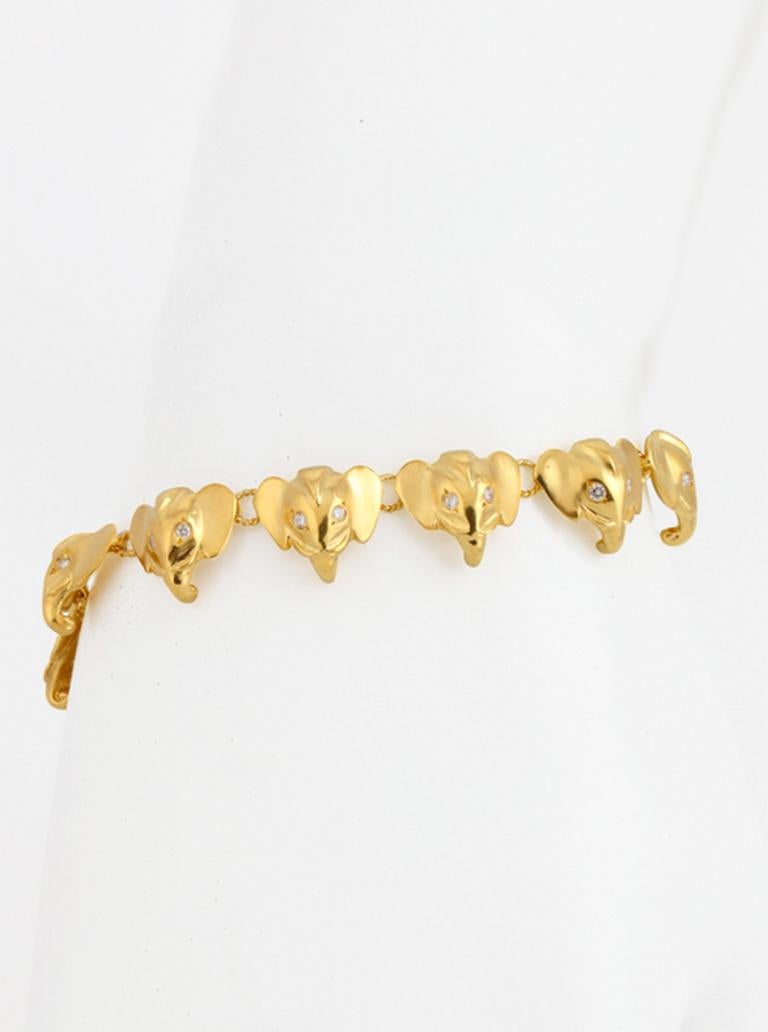 18k. Gold and Diamonds. Each Elephant head is individually lost wax cast in 18k, hand polished and then assembled with 18k hand made links. There are 22 round brilliant white diamond eyes. Toggle clasp.  

This piece was made in Manhattan by Prince
