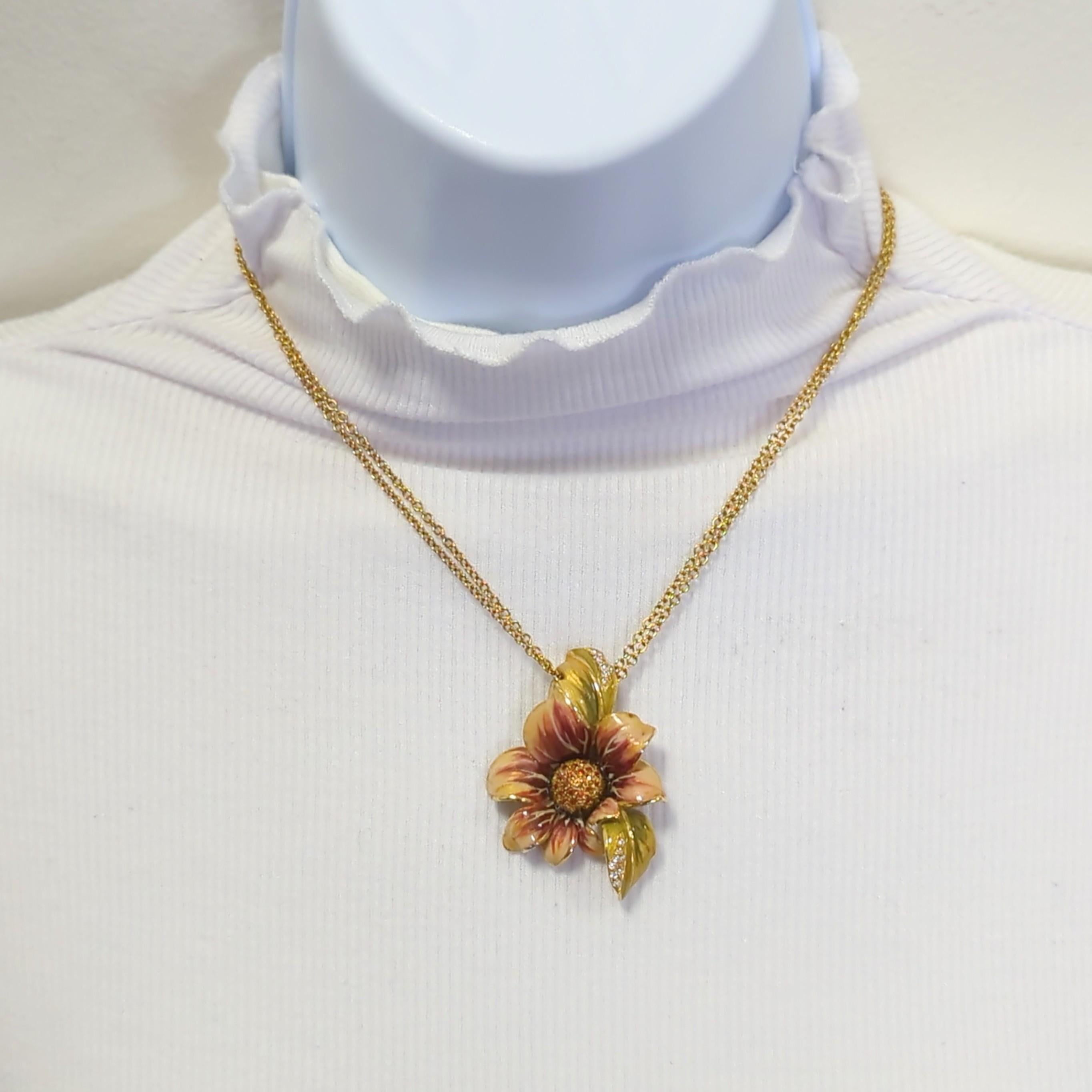 Beautiful flower design pendant with good quality white diamond rounds.  Handmade in 18k yellow gold.  Length is 16