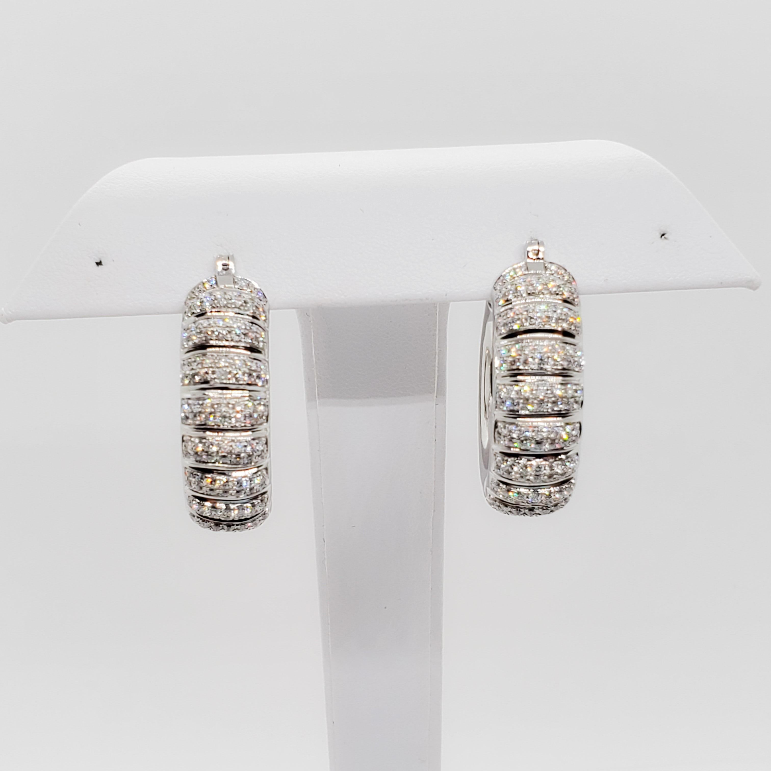 Beautiful diamond hoops with 3 carats of good quality, white, and bright diamonds in handmade 18k white gold mountings.  These earrings are chunky and fun.  Perfect for day or night, making them so versatile and easy to wear.  Excellent condition.